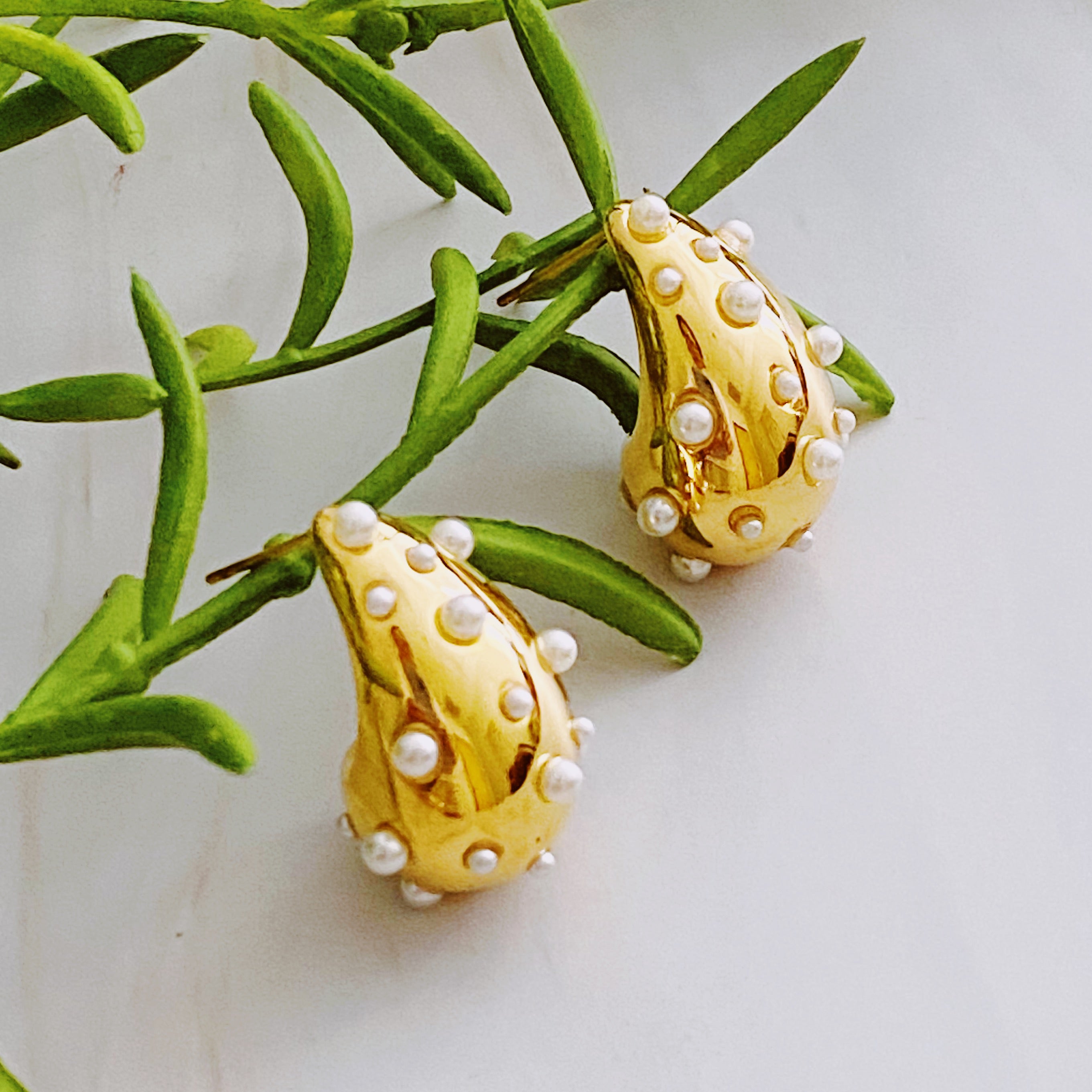 So Chic Jeweled Teardrop Earrings featuring a luxurious teardrop shape with sparkling stones, crafted from 18k gold plated stainless steel.