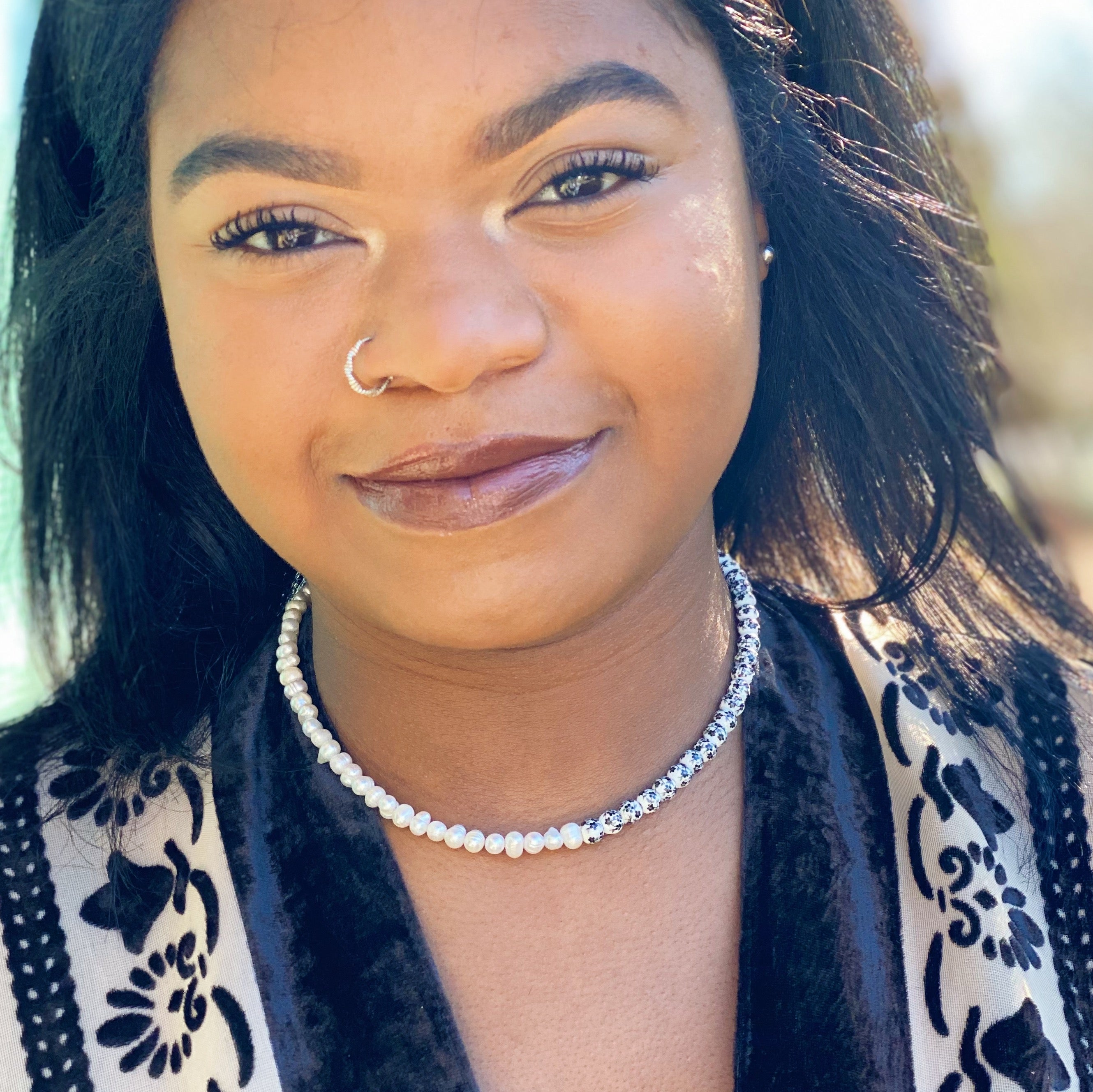 So Fresh Pearl and Porcelain Choker Necklace featuring freshwater pearls and ceramic beads, elegantly designed with gold plated stainless steel accents.