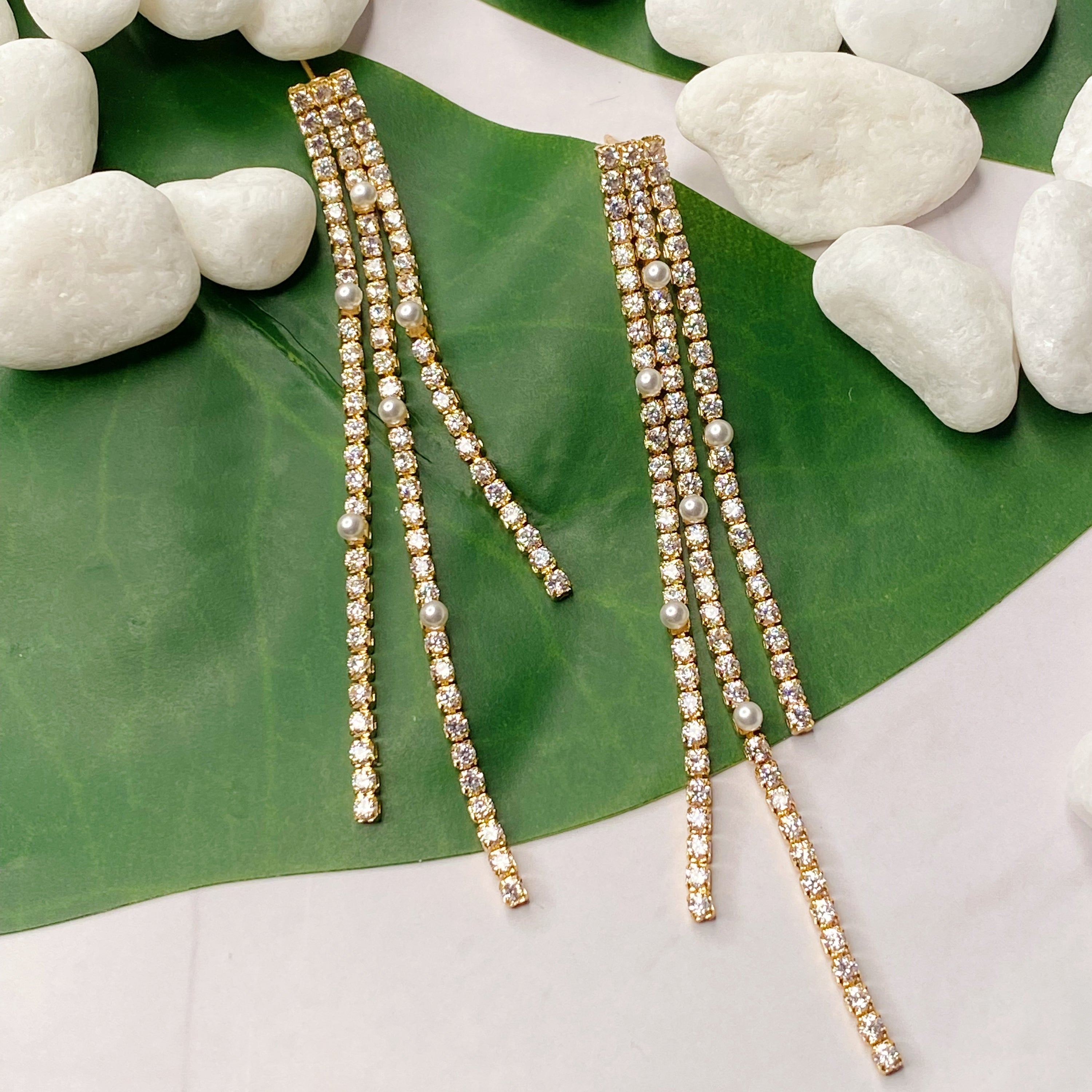 So Influencer Earrings featuring three sparkly strands and tiny glass pearls, elegantly designed for a stylish statement.