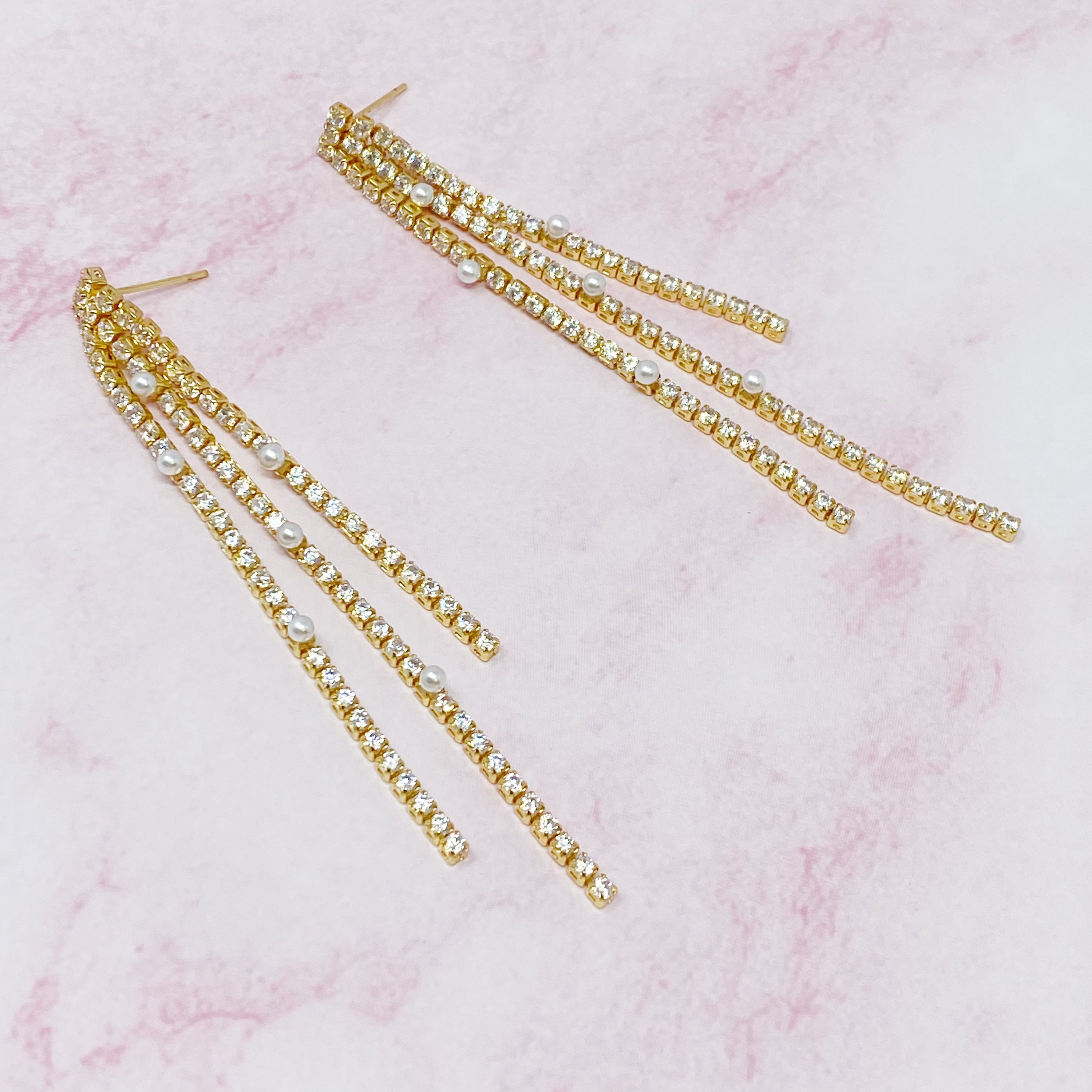 So Influencer Earrings featuring three sparkly strands and tiny glass pearls, elegantly designed for a stylish statement.