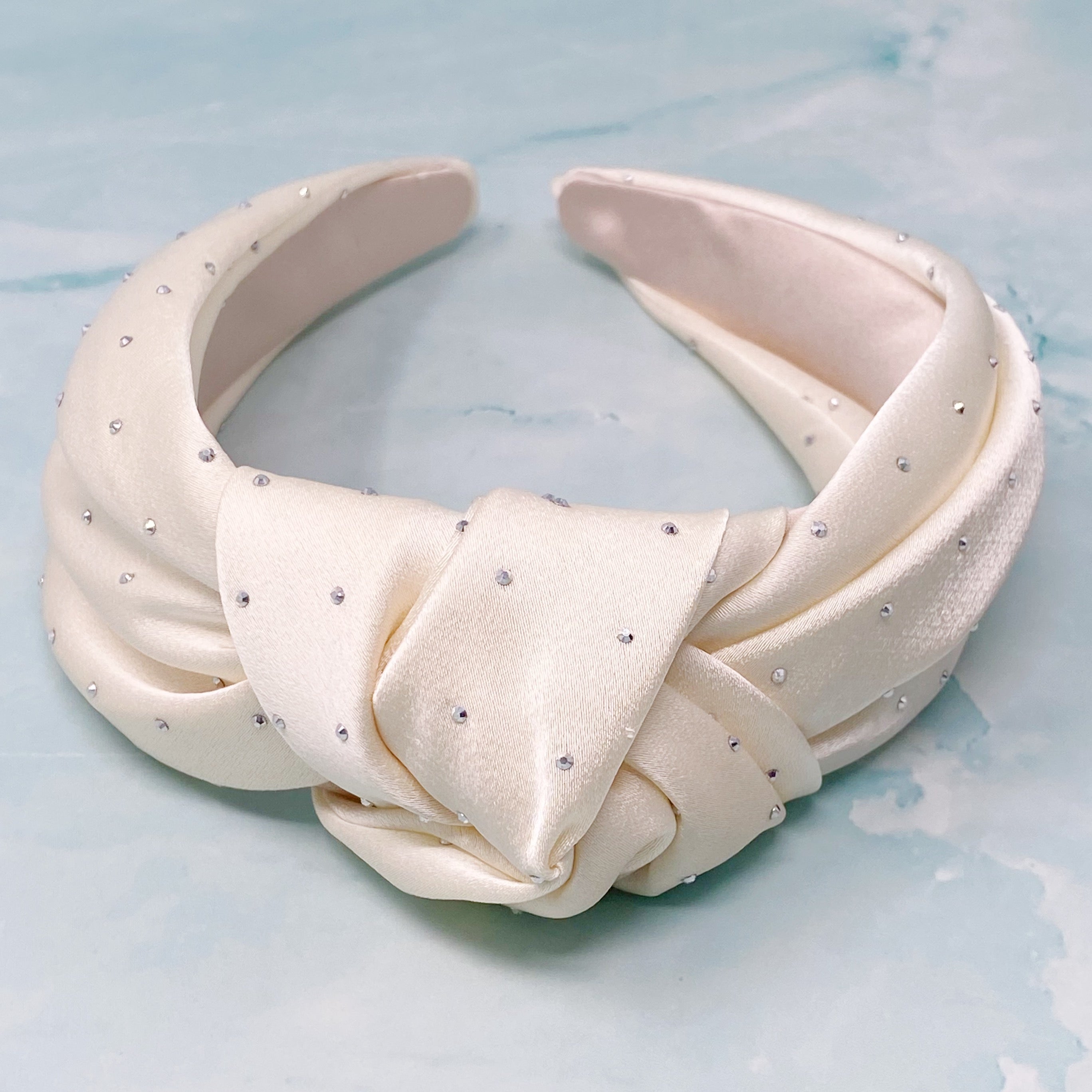 So Satin Knotted Headband featuring silky fabric and muted shiny beads, designed for comfort and elegance.