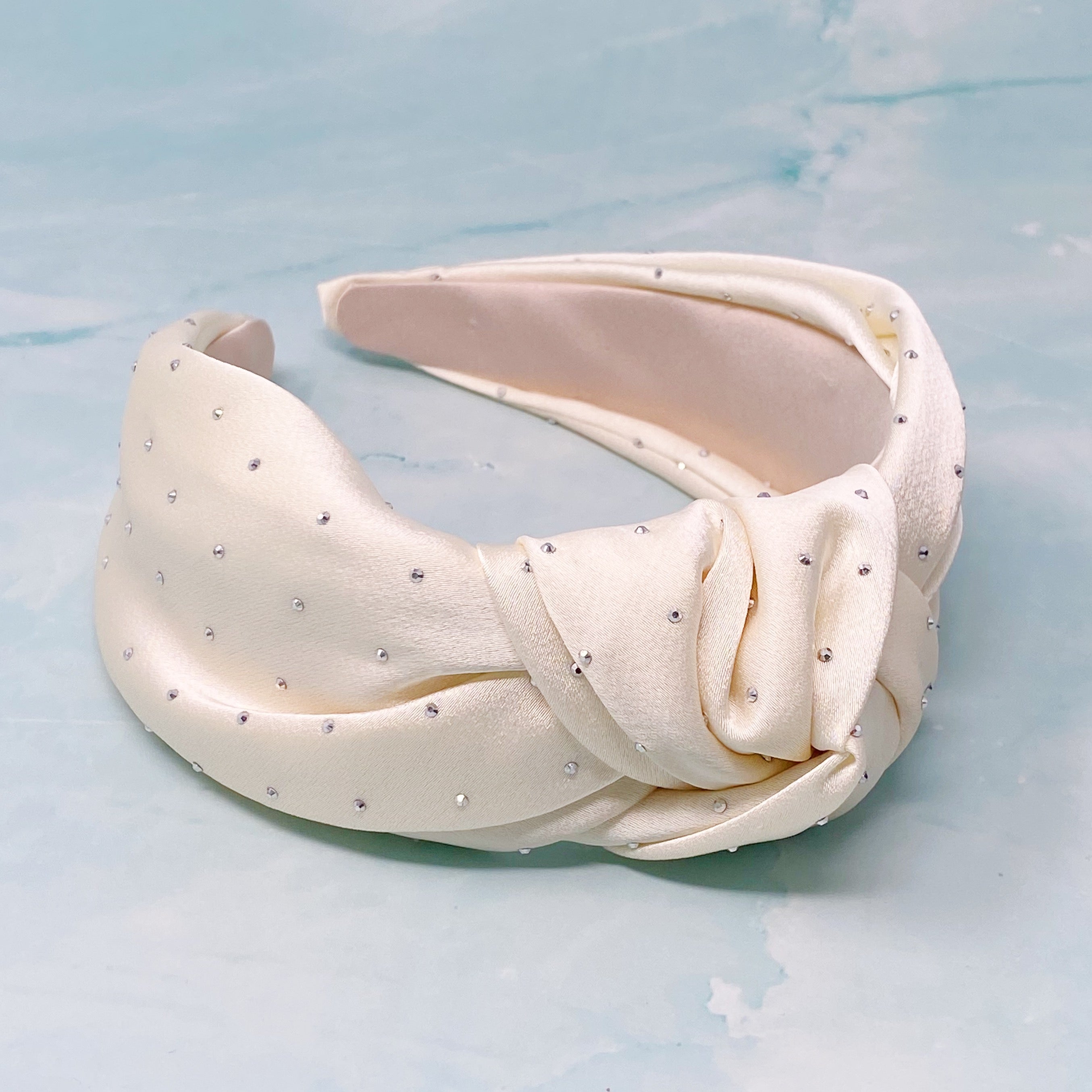 So Satin Knotted Headband featuring silky fabric and muted shiny beads, designed for comfort and elegance.