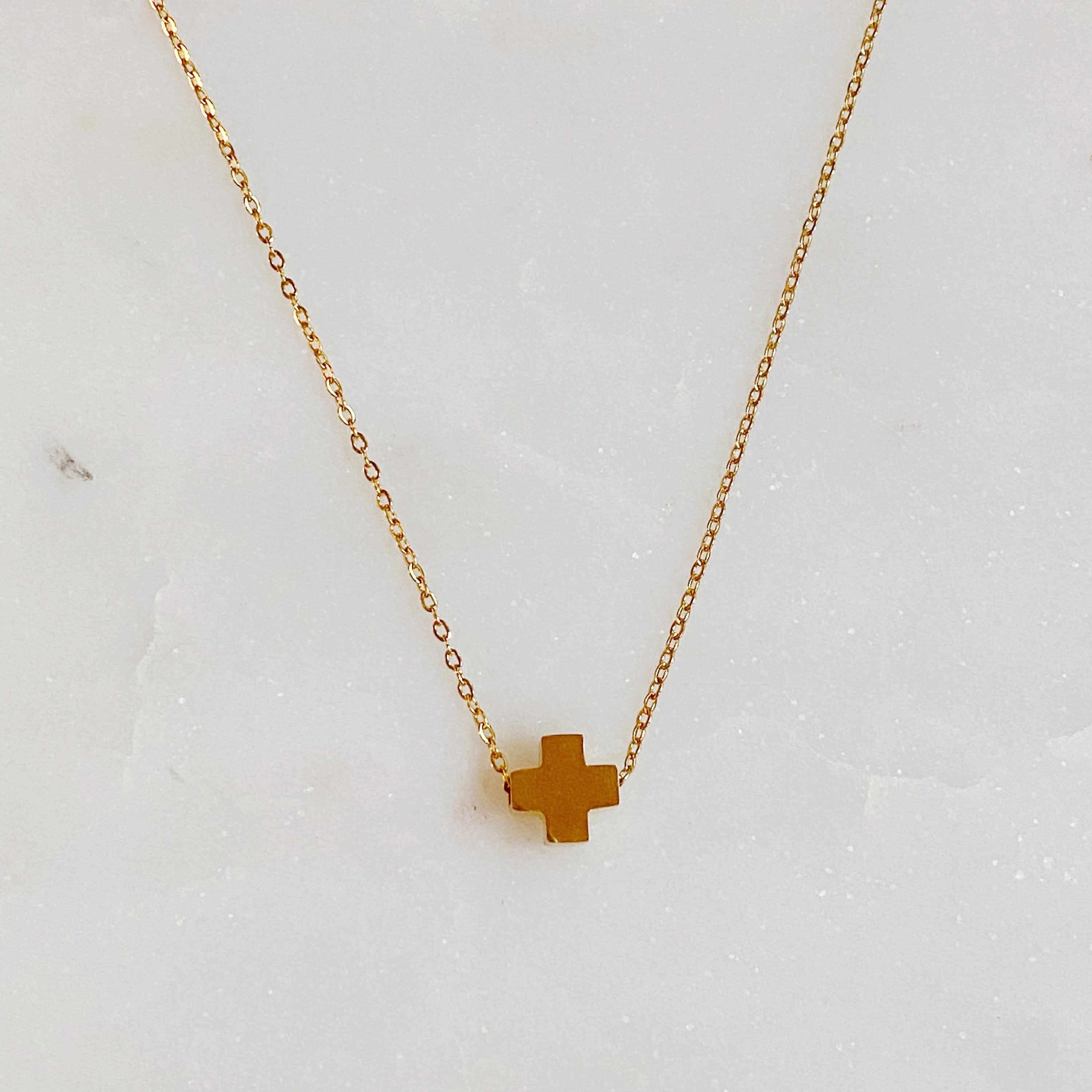 So Very Blessed Cross Necklace featuring a gold plated brass cross and colorful natural stone beads on a stainless steel chain.