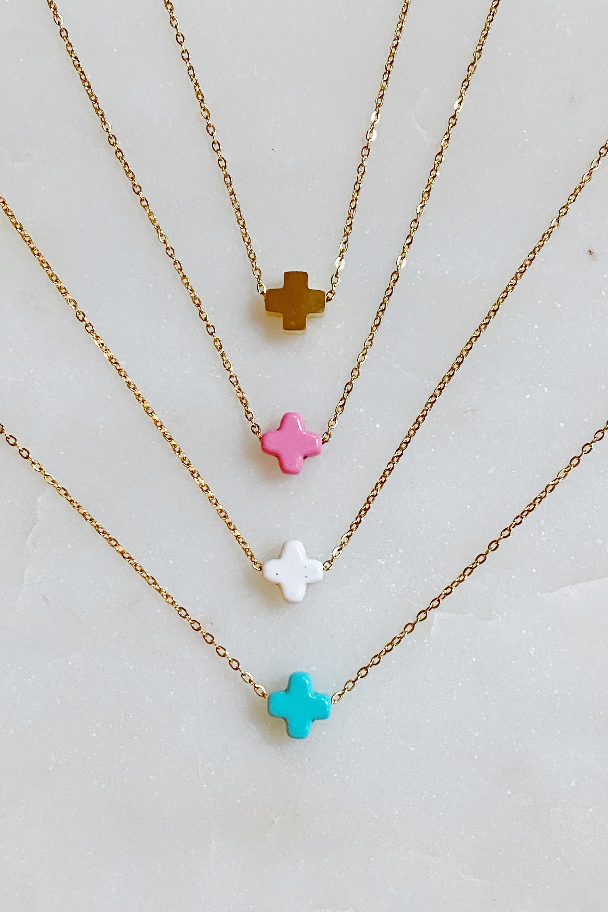 So Very Blessed Cross Necklace featuring a gold plated brass cross and colorful natural stone beads on a stainless steel chain.