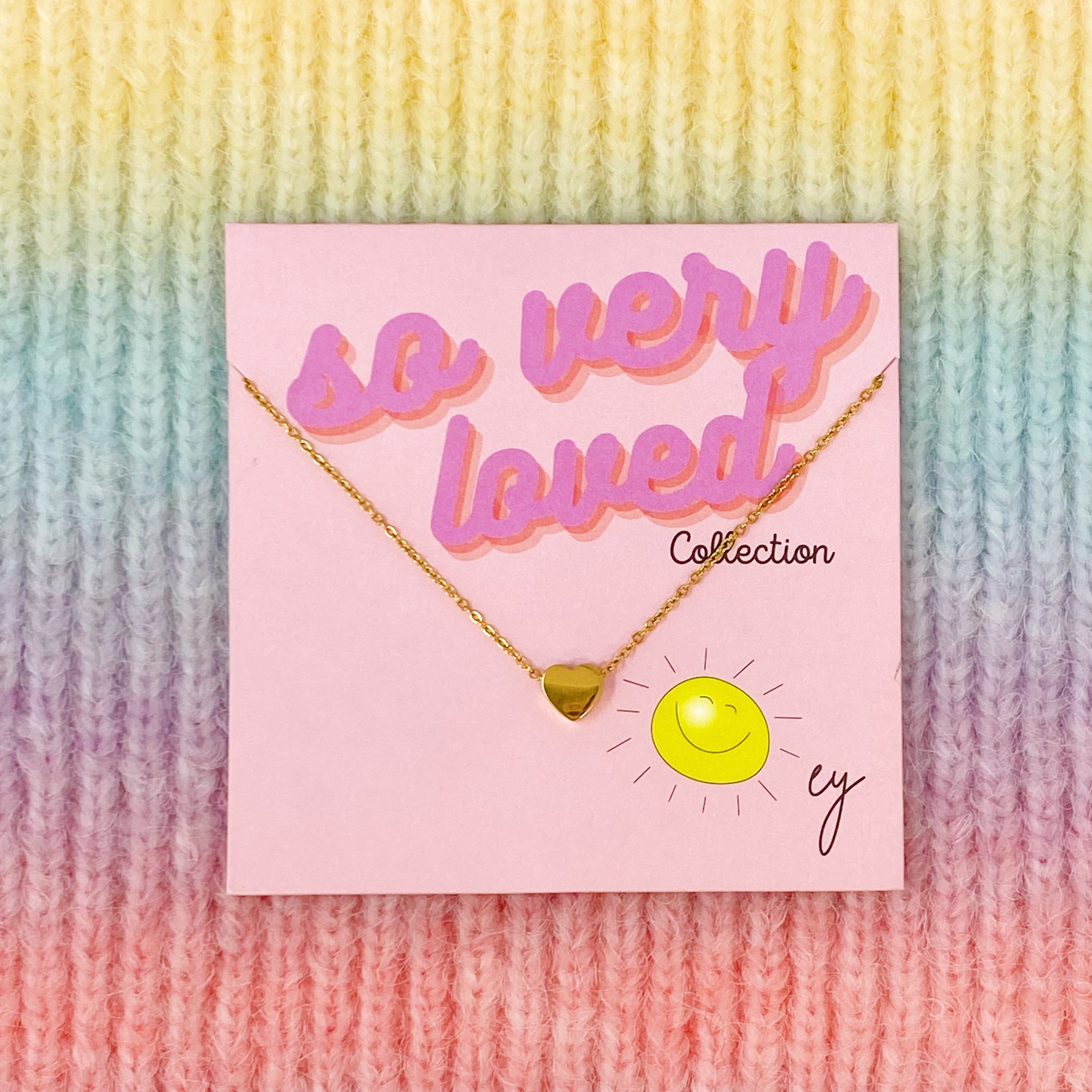 So Very Loved Heart Necklace featuring a colorful heart pendant on a gold plated chain, perfect for everyday wear.