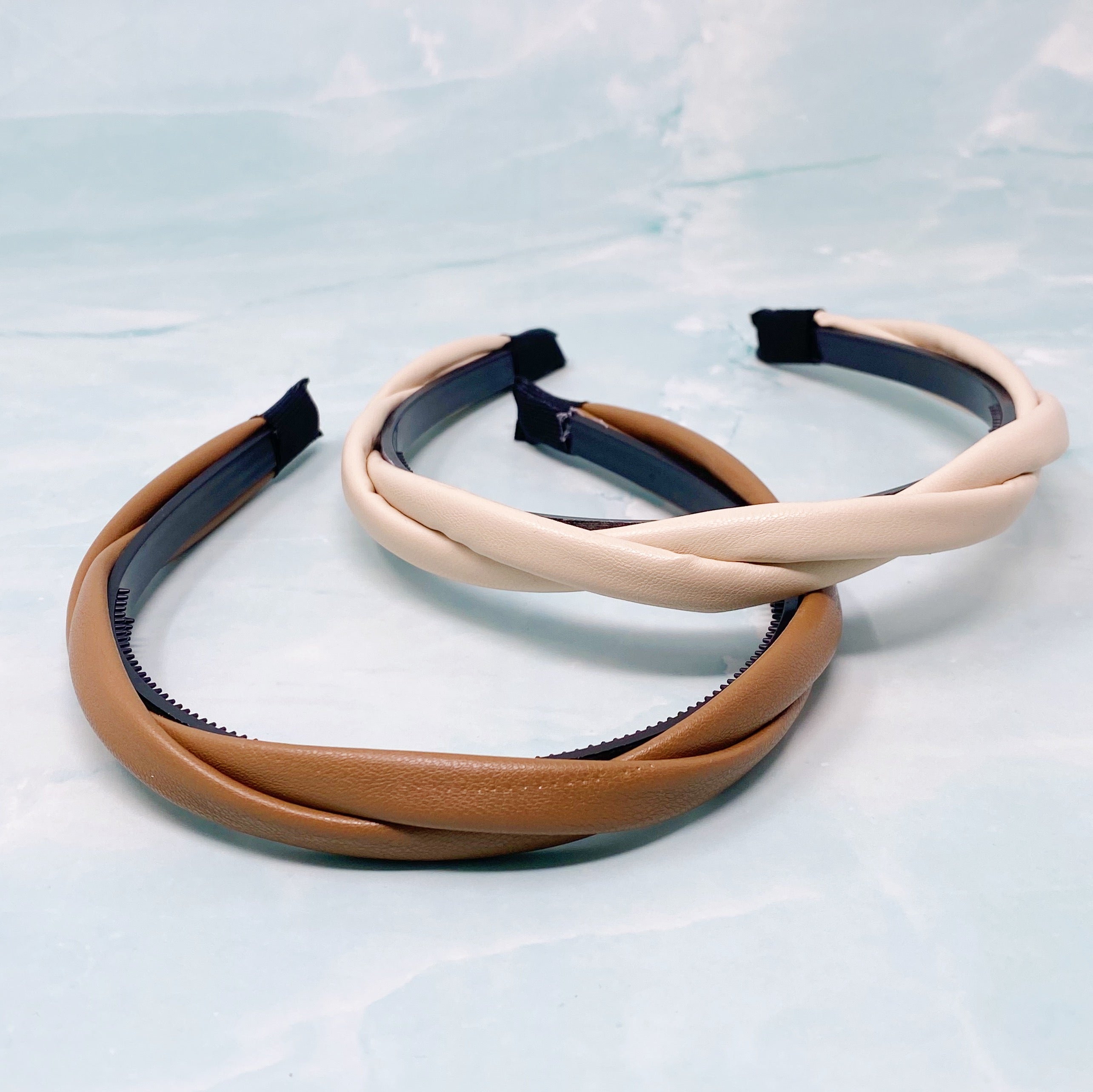 Soho Soft Daily Headband Set of 2 featuring vegan leather with a softly twisted design in neutral colors.