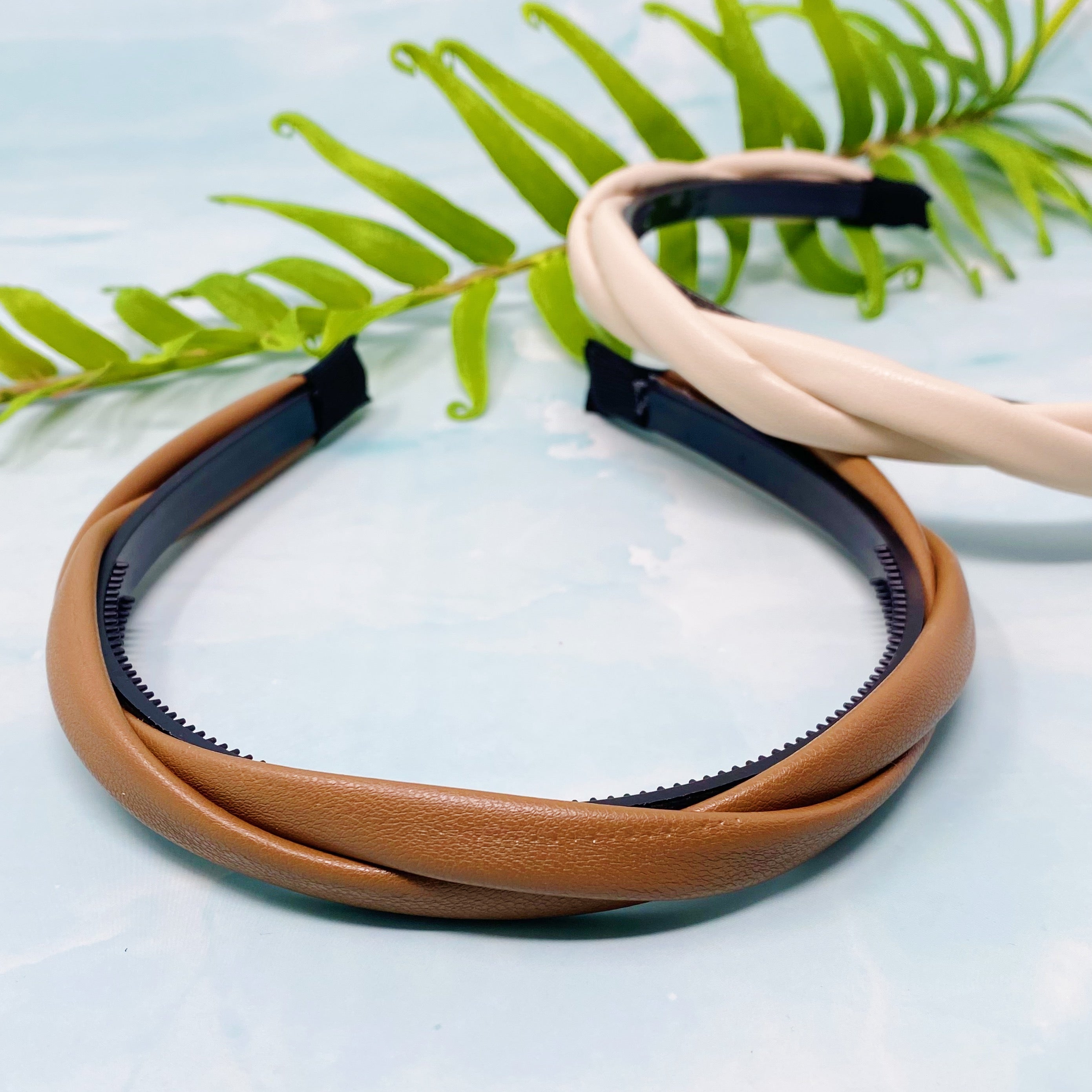 Soho Soft Daily Headband Set of 2 featuring vegan leather with a softly twisted design in neutral colors.