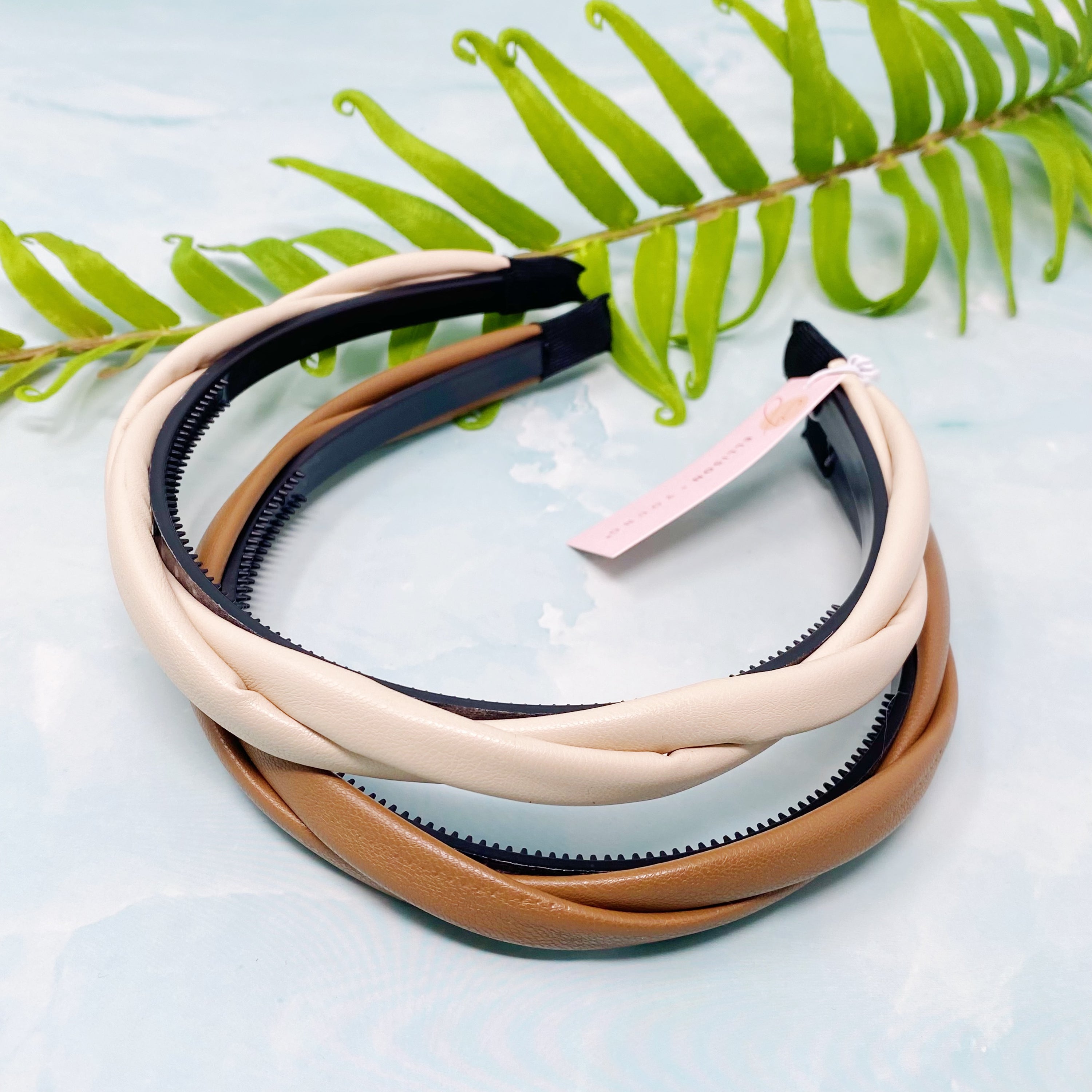 Soho Soft Daily Headband Set of 2 featuring vegan leather with a softly twisted design in neutral colors.