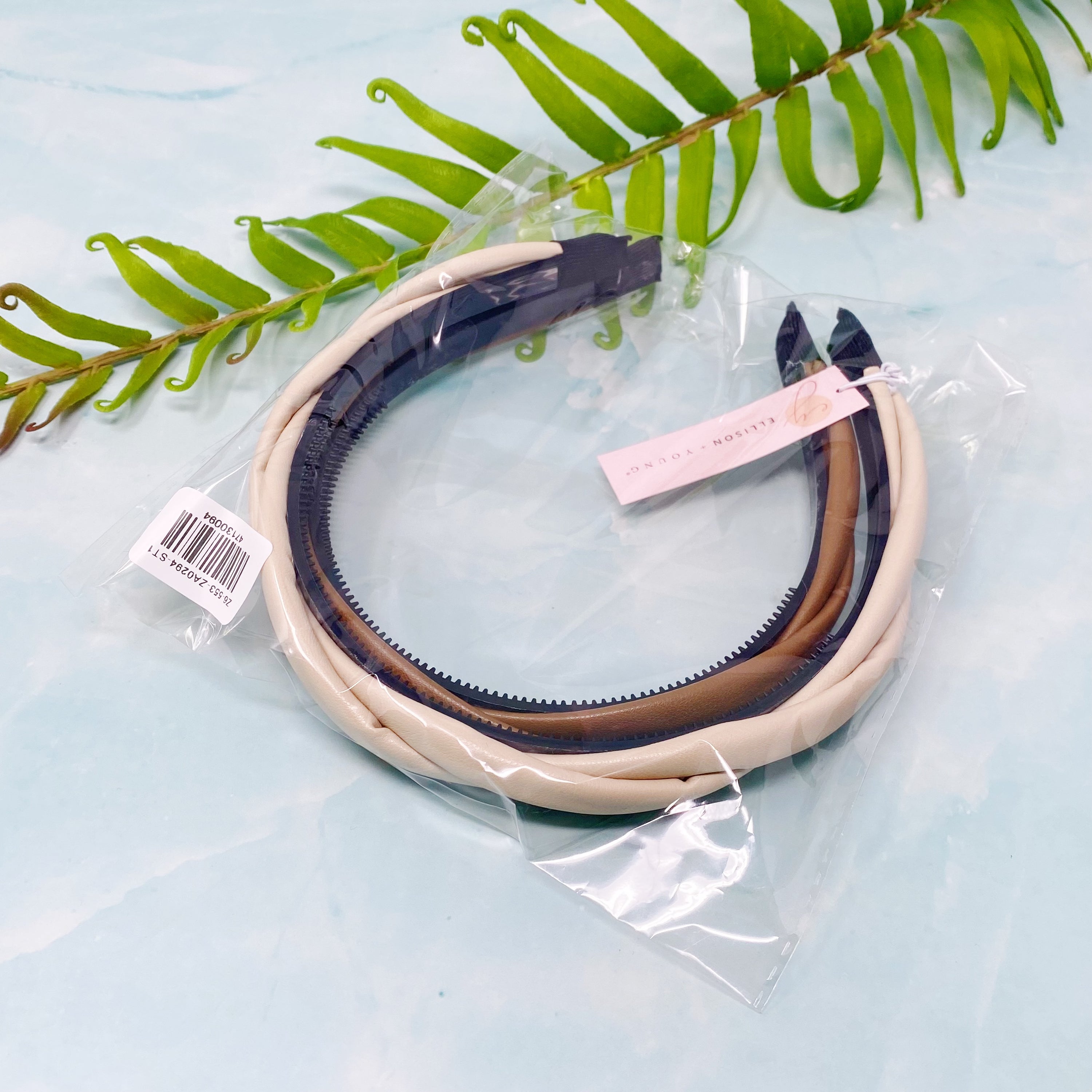 Soho Soft Daily Headband Set of 2 featuring vegan leather with a softly twisted design in neutral colors.