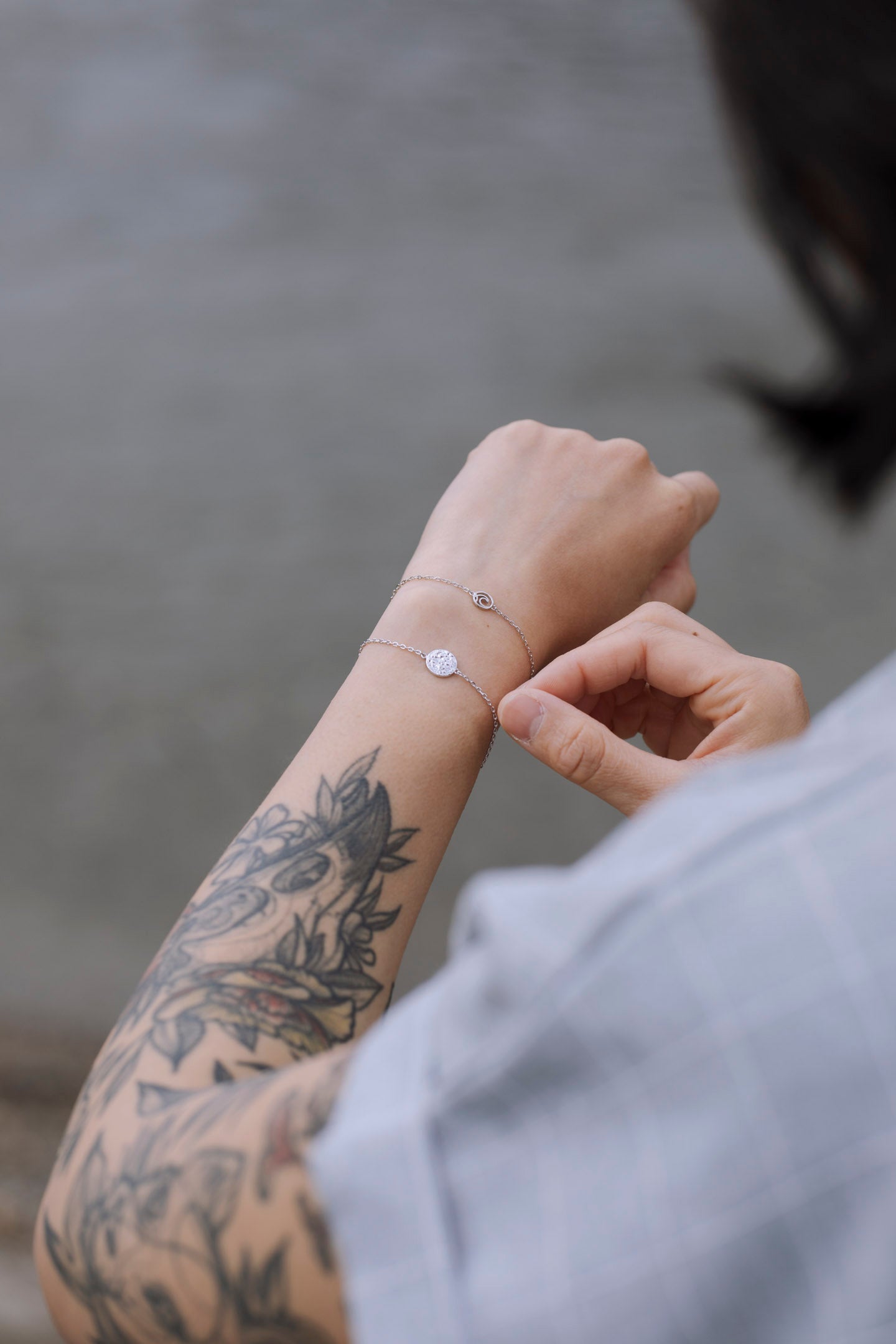 Sol Adjustable Bracelet featuring a textured circle design on an adjustable cable chain, available in sterling silver with three finishes.