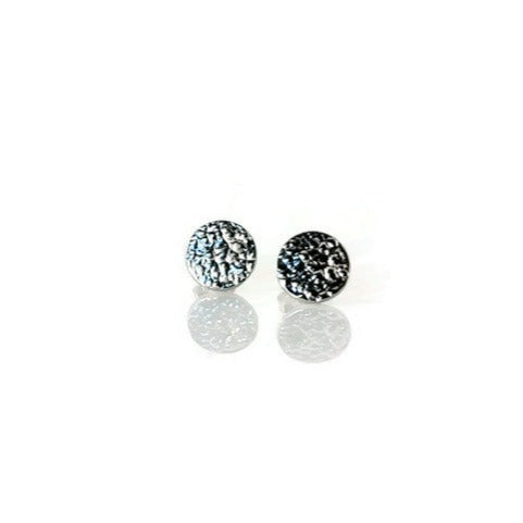 A pair of small textured circle stud earrings made of 925 sterling silver, showcasing their sparkling design and available finishes.