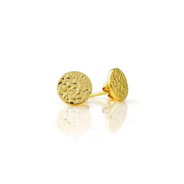 A pair of small textured circle stud earrings made of 925 sterling silver, showcasing their sparkling design and available finishes.