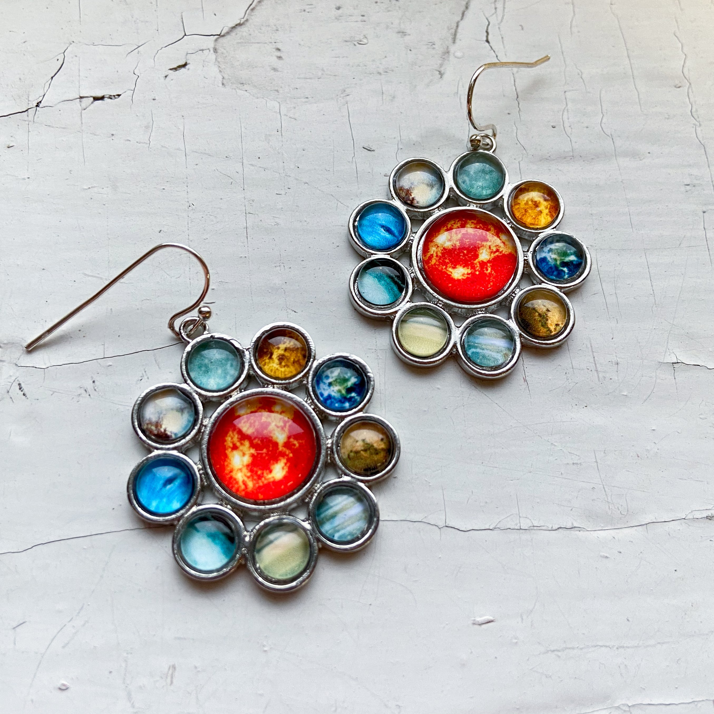 Solar System Halo Jewelry Set featuring a colorful pendant and earrings with planets and the Sun, handcrafted from rhodium plated brass and glass.