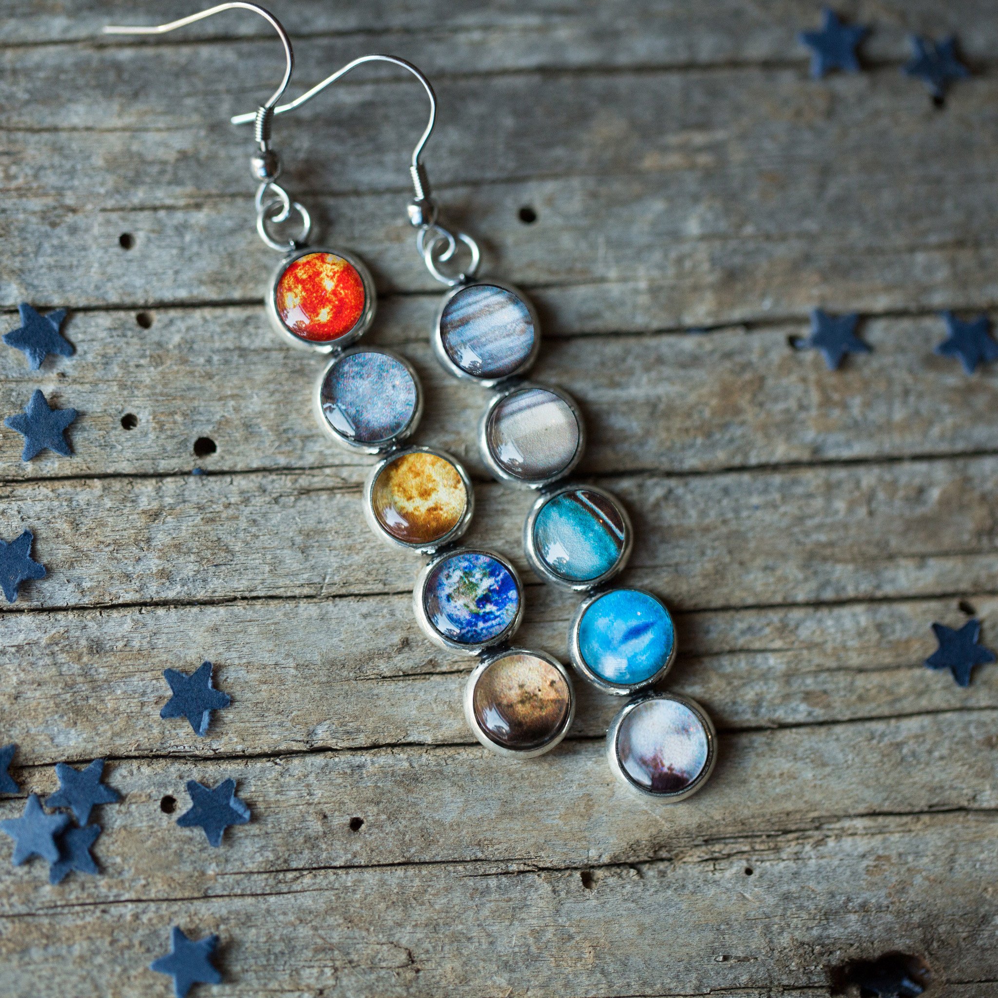 Colorful Solar System Mis-Matched Earrings featuring planets and the Sun in silver-tone bezels, hanging from French hooks.