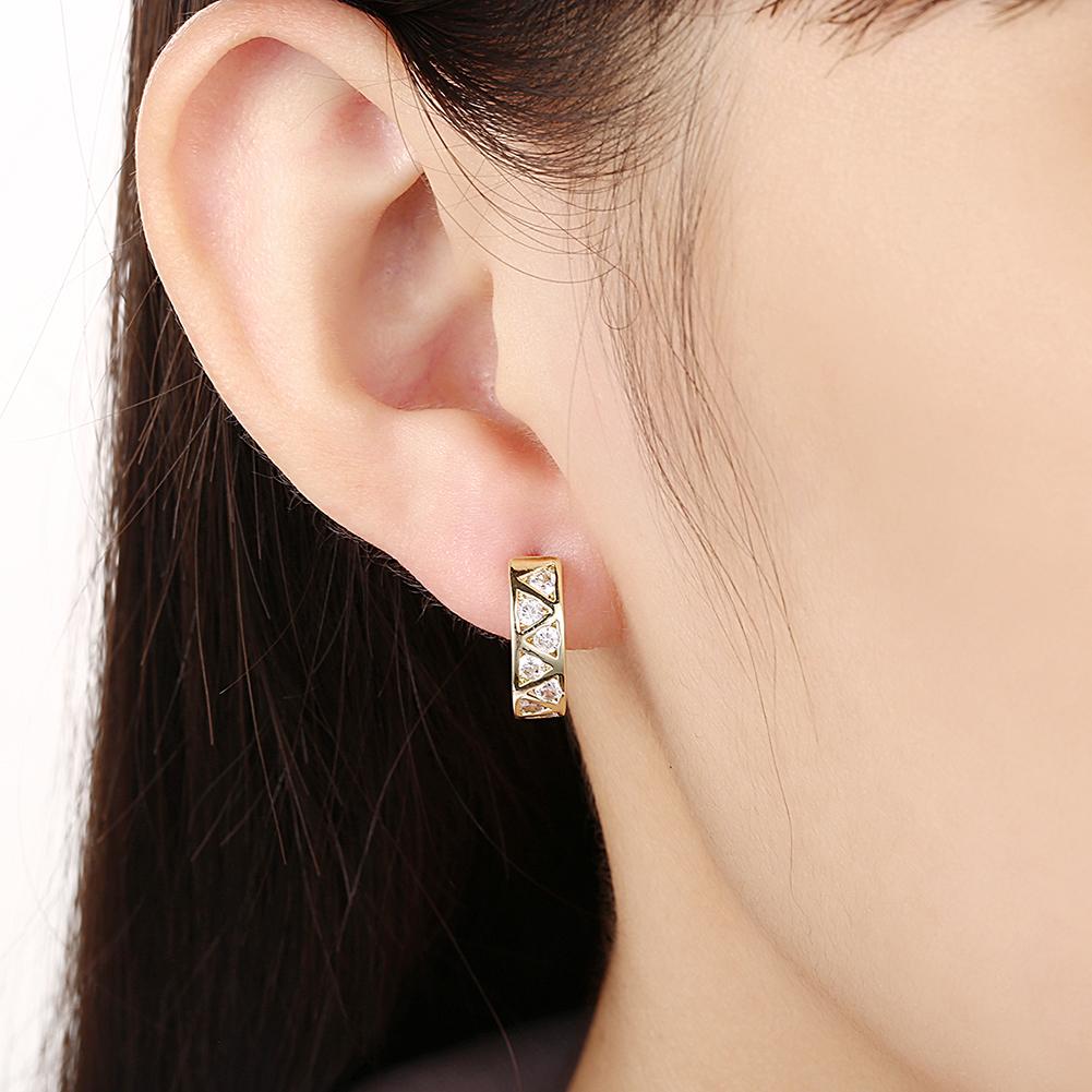 Elegant Solitaire Elements Mini Clip On Earrings featuring certified crystals and 18K gold plating, designed for comfort and style.