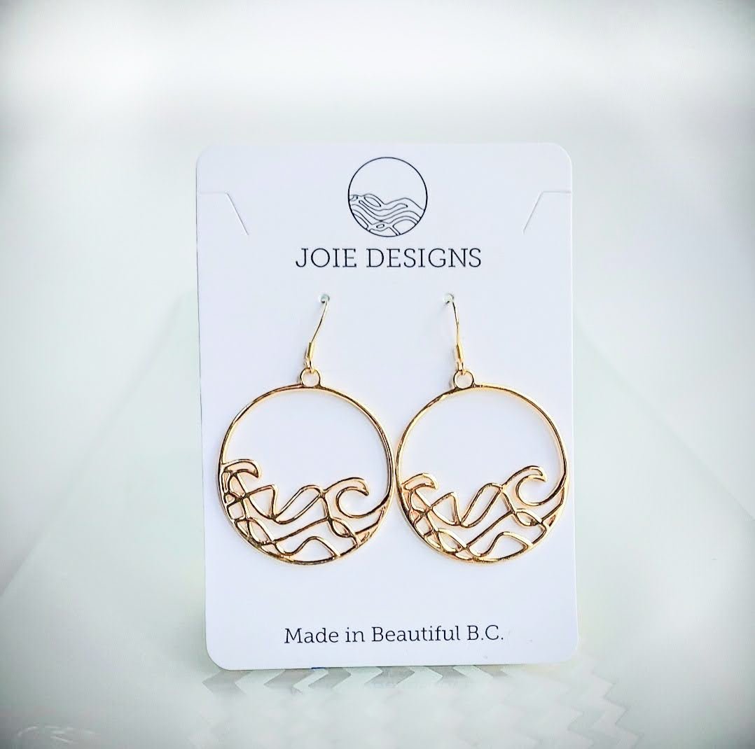 Sombrio Circle Surf Wave Earrings in sterling silver with wave design, showcasing their elegant circular shape and available plating options.