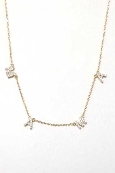 A dainty Sparkle Mama Necklace featuring cubic zirconia on a 16-inch chain with a 3-inch extender, elegantly displayed.