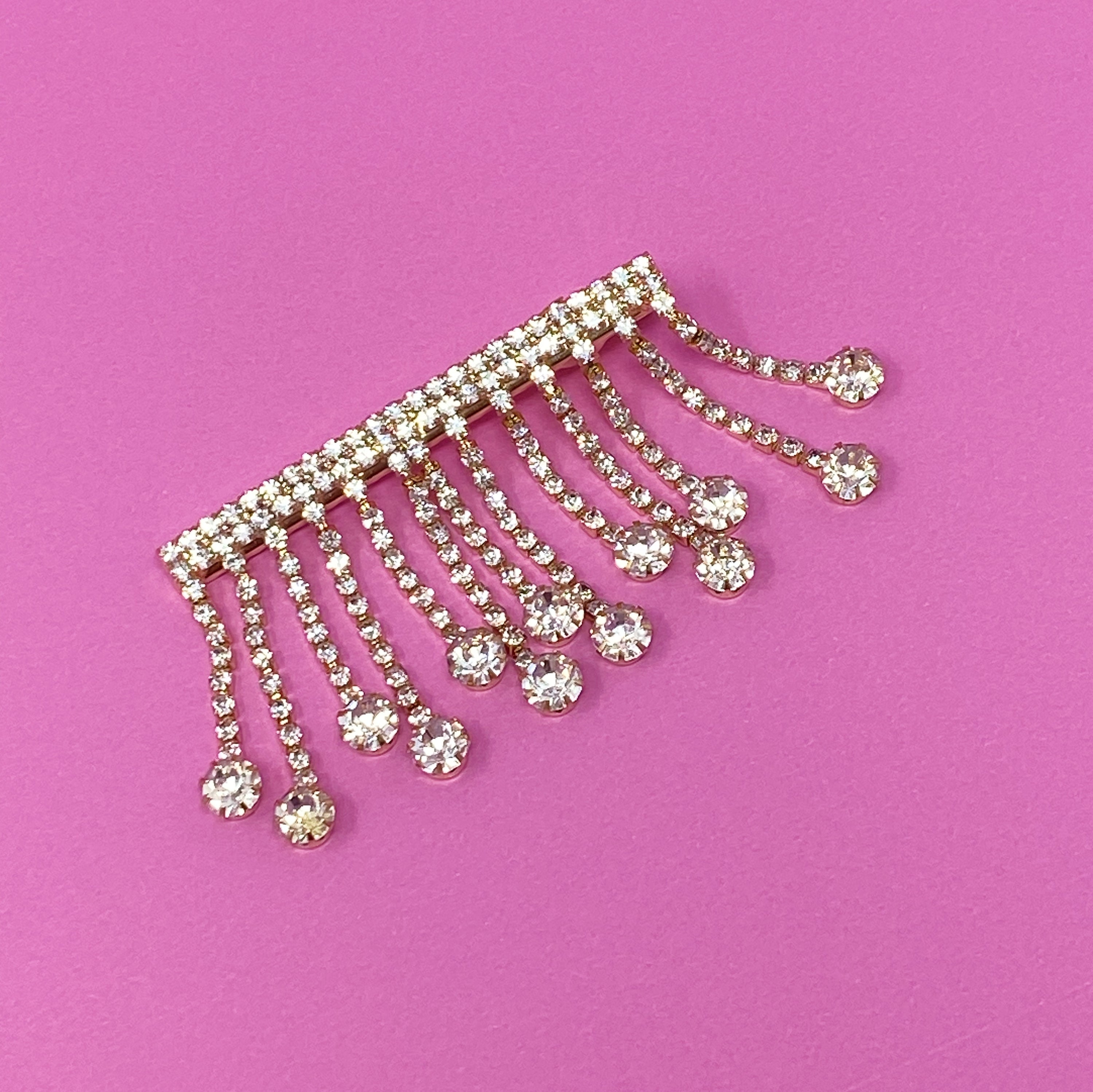 A stylish Sparkling Cascade Hair Clip featuring dangling sparkles, perfect for enhancing hairstyles.