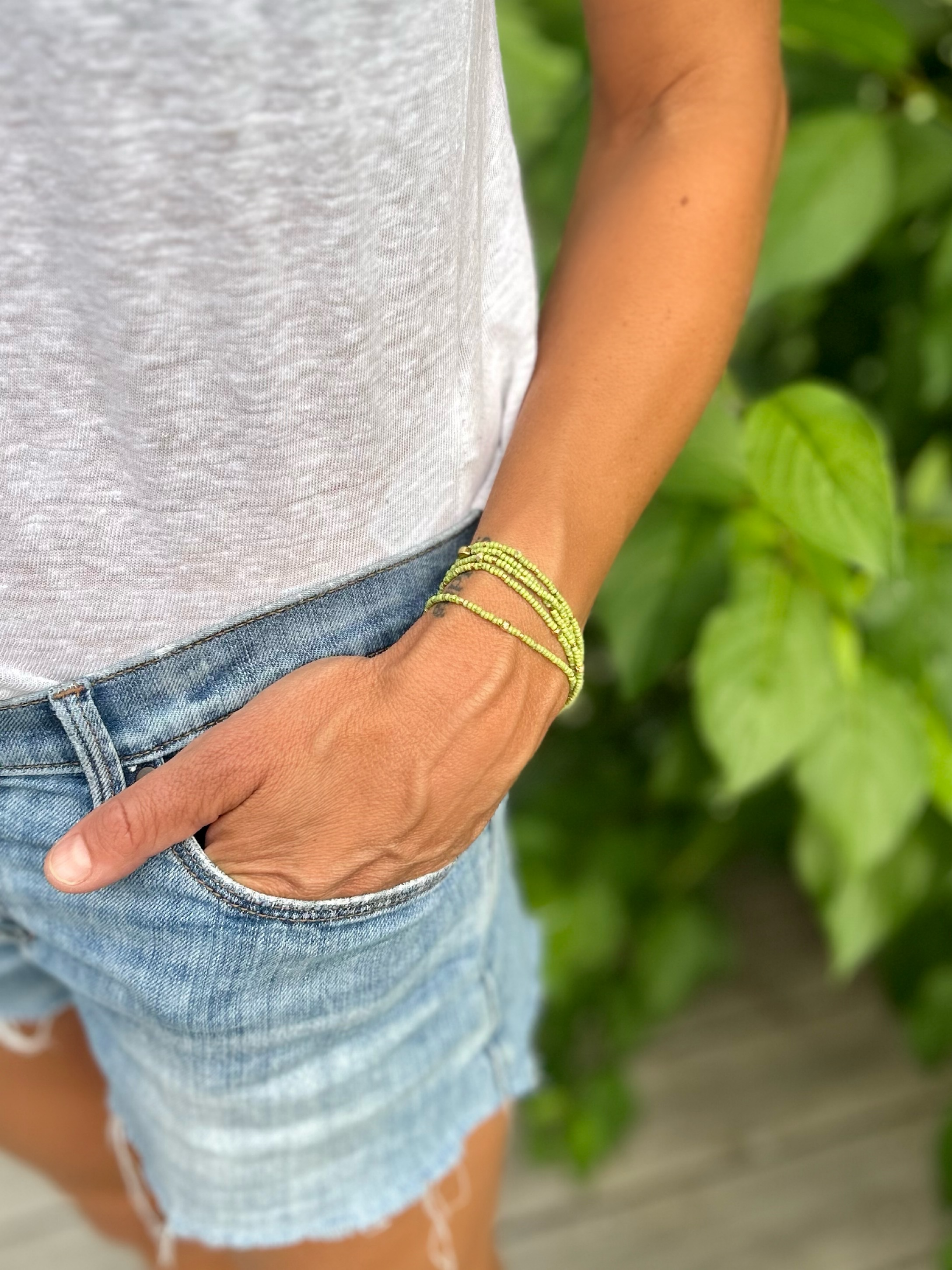 Speckled lime green and gold-sprinkled beaded 5-wrap bracelet made from MIYUKI glass seed beads, showcasing vibrant colors and elegant design.