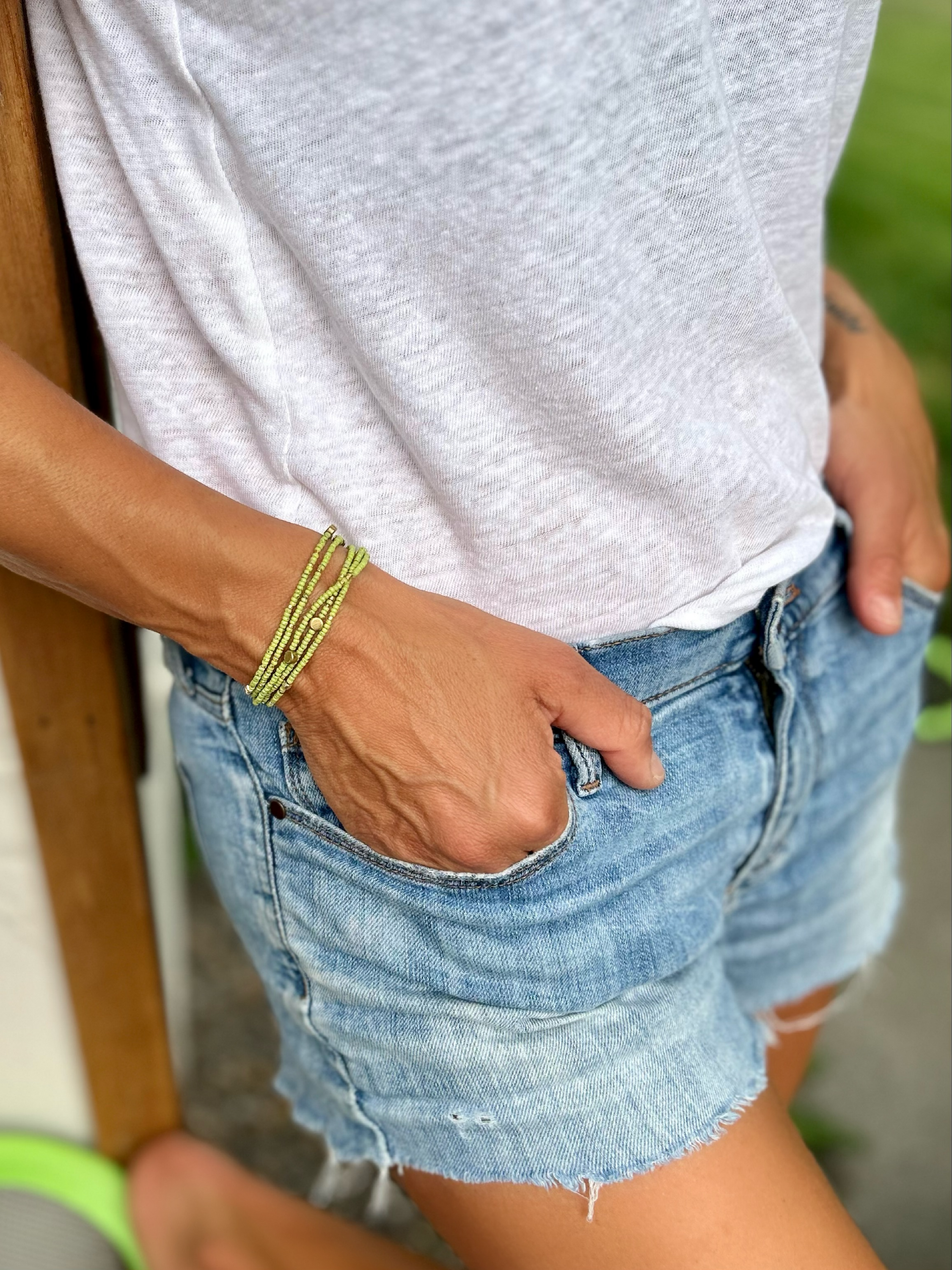 Speckled lime green and gold-sprinkled beaded 5-wrap bracelet made from MIYUKI glass seed beads, showcasing vibrant colors and elegant design.