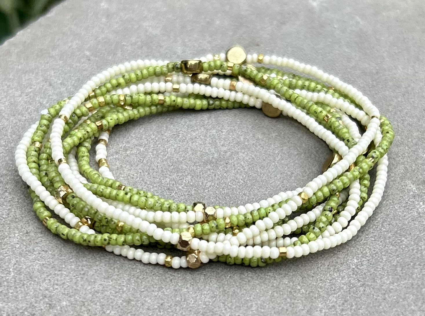 Speckled lime green and gold-sprinkled beaded 5-wrap bracelet made from MIYUKI glass seed beads, showcasing vibrant colors and elegant design.