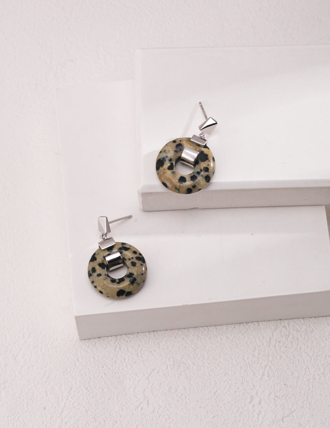 Handmade speckled stone hoops earrings with gold vermeil finish, showcasing their unique design and elegant craftsmanship.