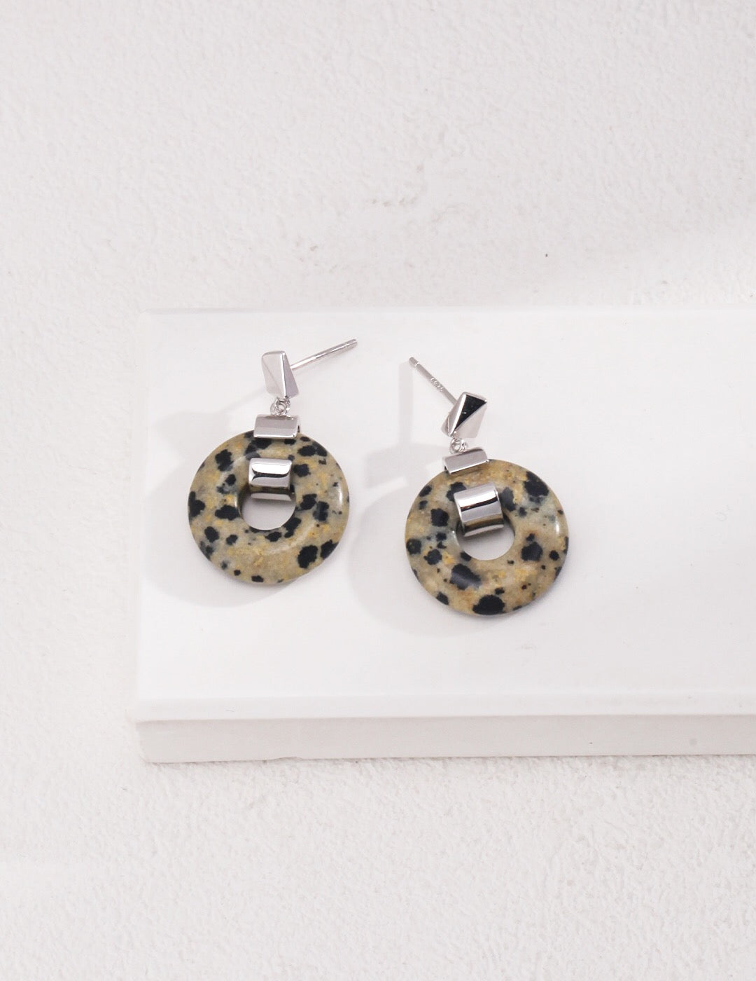 Handmade speckled stone hoops earrings with gold vermeil finish, showcasing their unique design and elegant craftsmanship.