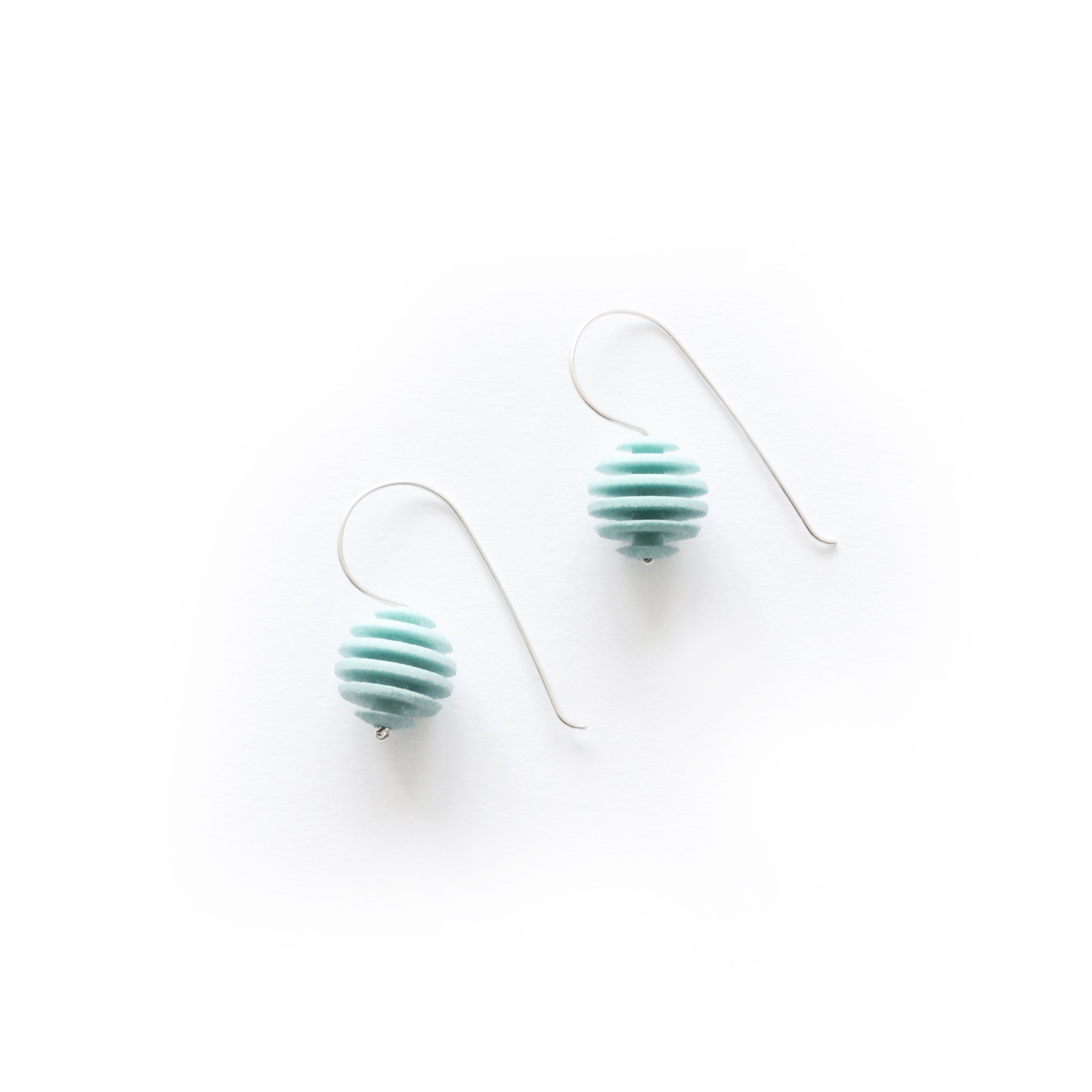 Sphere Earrings featuring an Optical design with Sterling Silver hooks, showcasing a modern twist on classic pearl earrings.