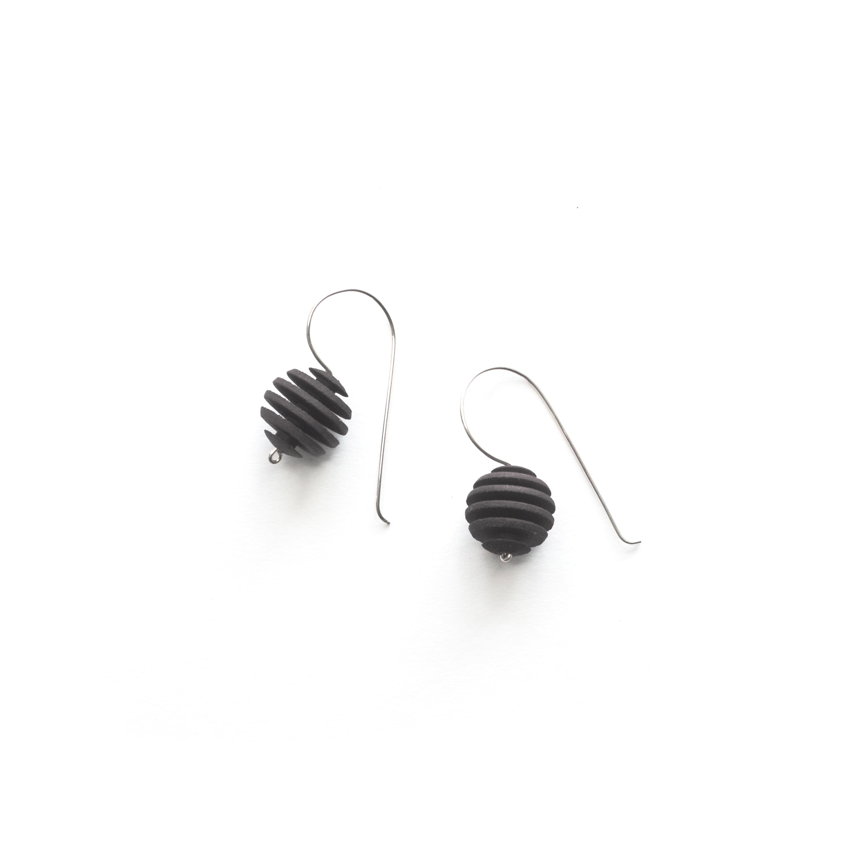 Sphere Earrings featuring an Optical design with Sterling Silver hooks, showcasing a modern twist on classic pearl earrings.