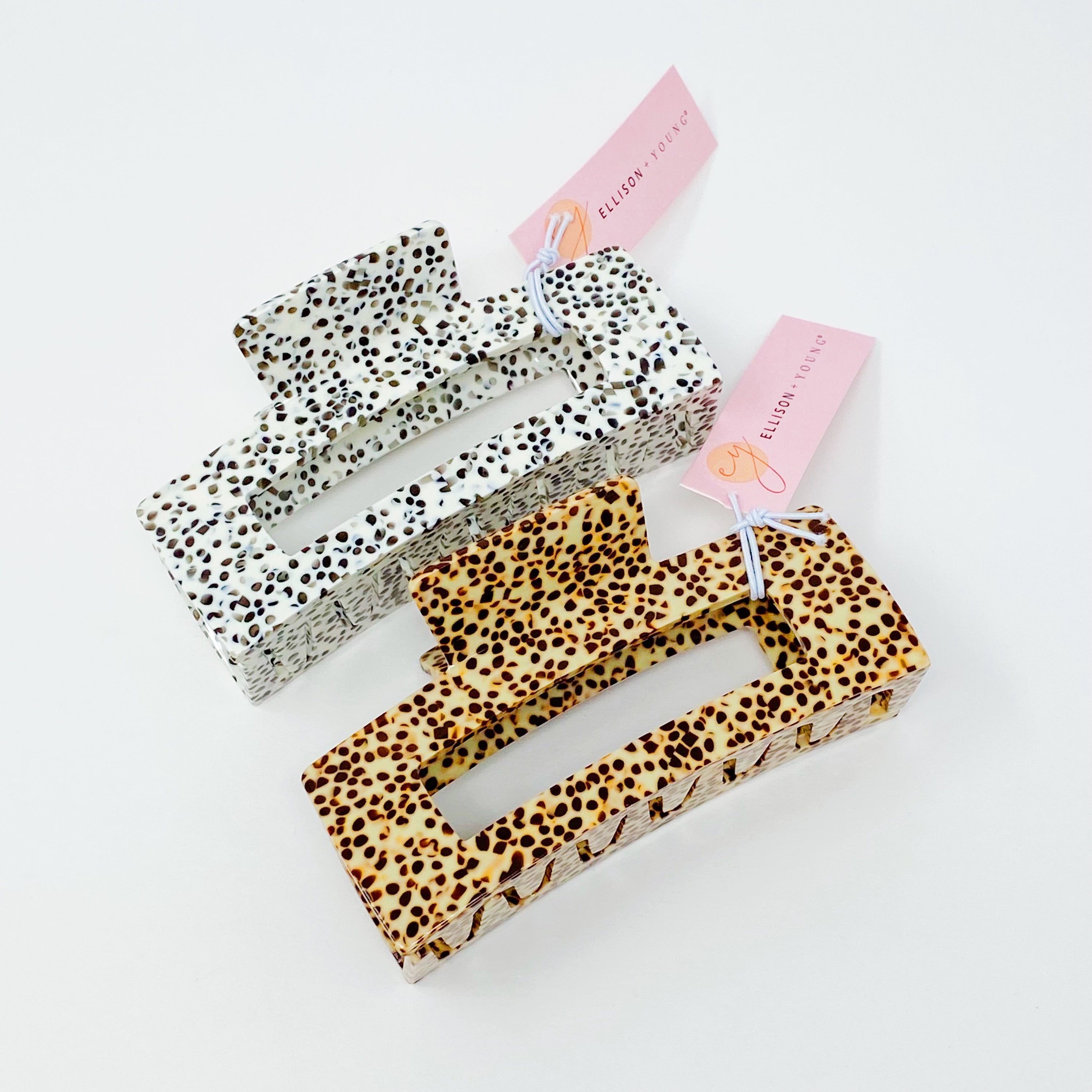 A stylish spotted print full hair claw made of high-quality acrylic, designed to hold hair securely.