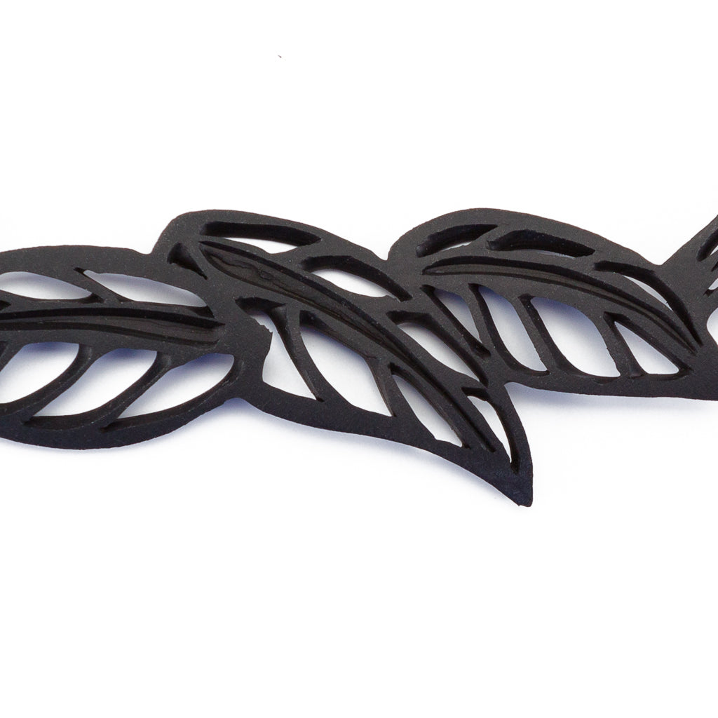 Handmade Spring Vegan Black Leaf Choker made from recycled inner tubes, featuring adjustable buttons and a unique design.