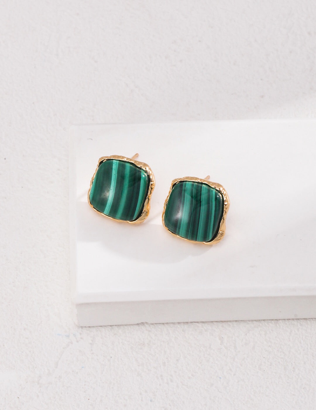 A pair of handcrafted square malachite stone earrings set in gold vermeil, showcasing vibrant green hues.