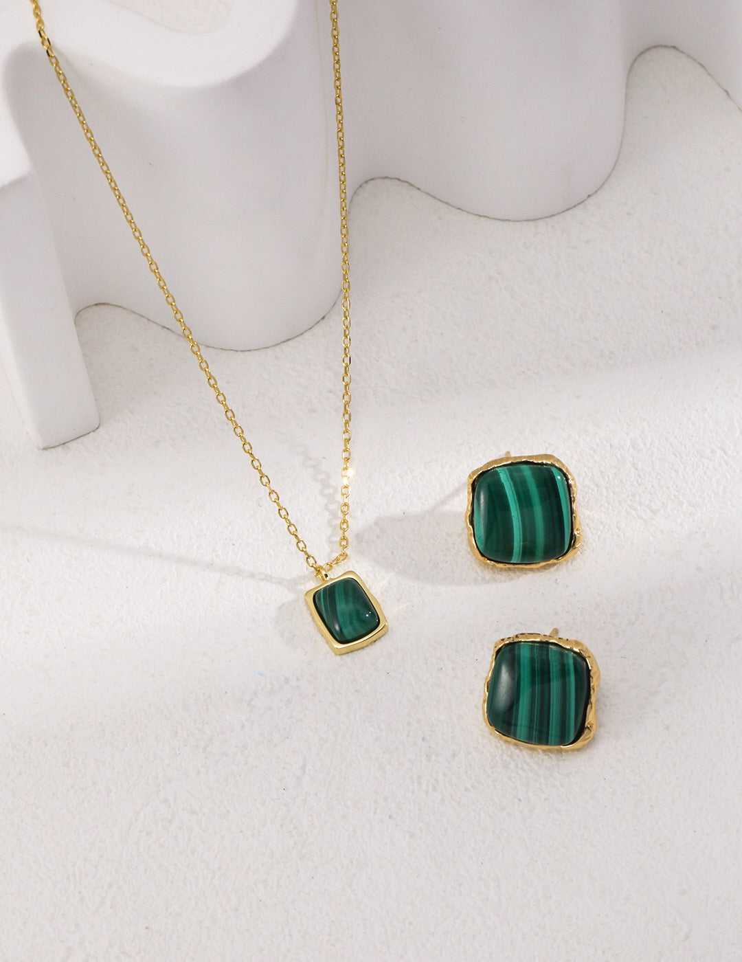 A pair of handcrafted square malachite stone earrings set in gold vermeil, showcasing vibrant green hues.