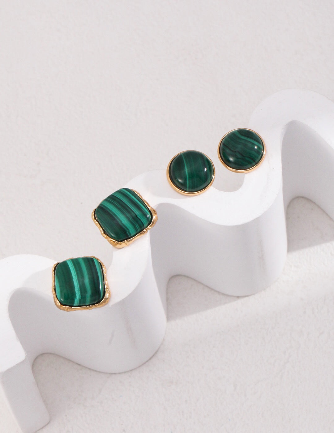 A pair of handcrafted square malachite stone earrings set in gold vermeil, showcasing vibrant green hues.