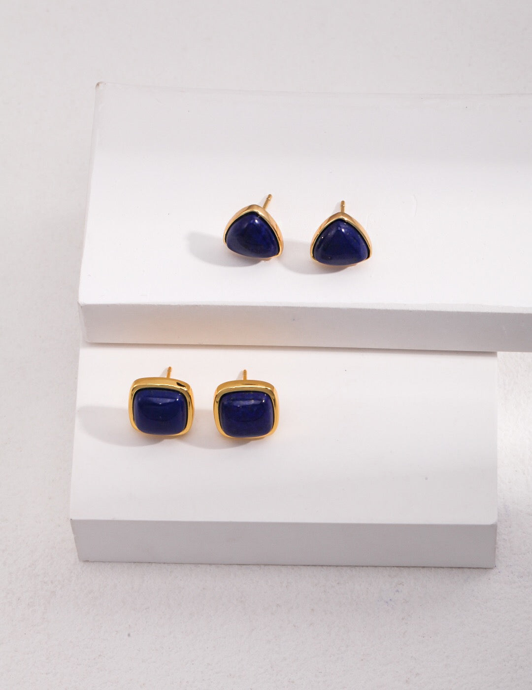 Handmade square earrings featuring natural lapis lazuli set in gold vermeil, showcasing a luxurious design.