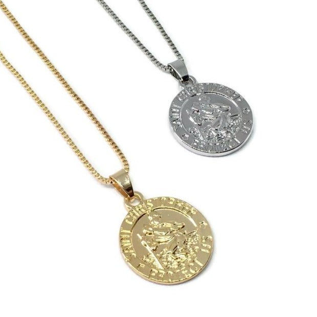 St Christopher Safe Travels Necklace featuring a gold and silver plated pendant with a 50cm chain, symbolizing protection for travelers.