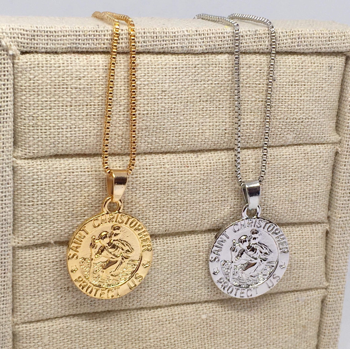 St Christopher Safe Travels Necklace featuring a gold and silver plated pendant with a 50cm chain, symbolizing protection for travelers.