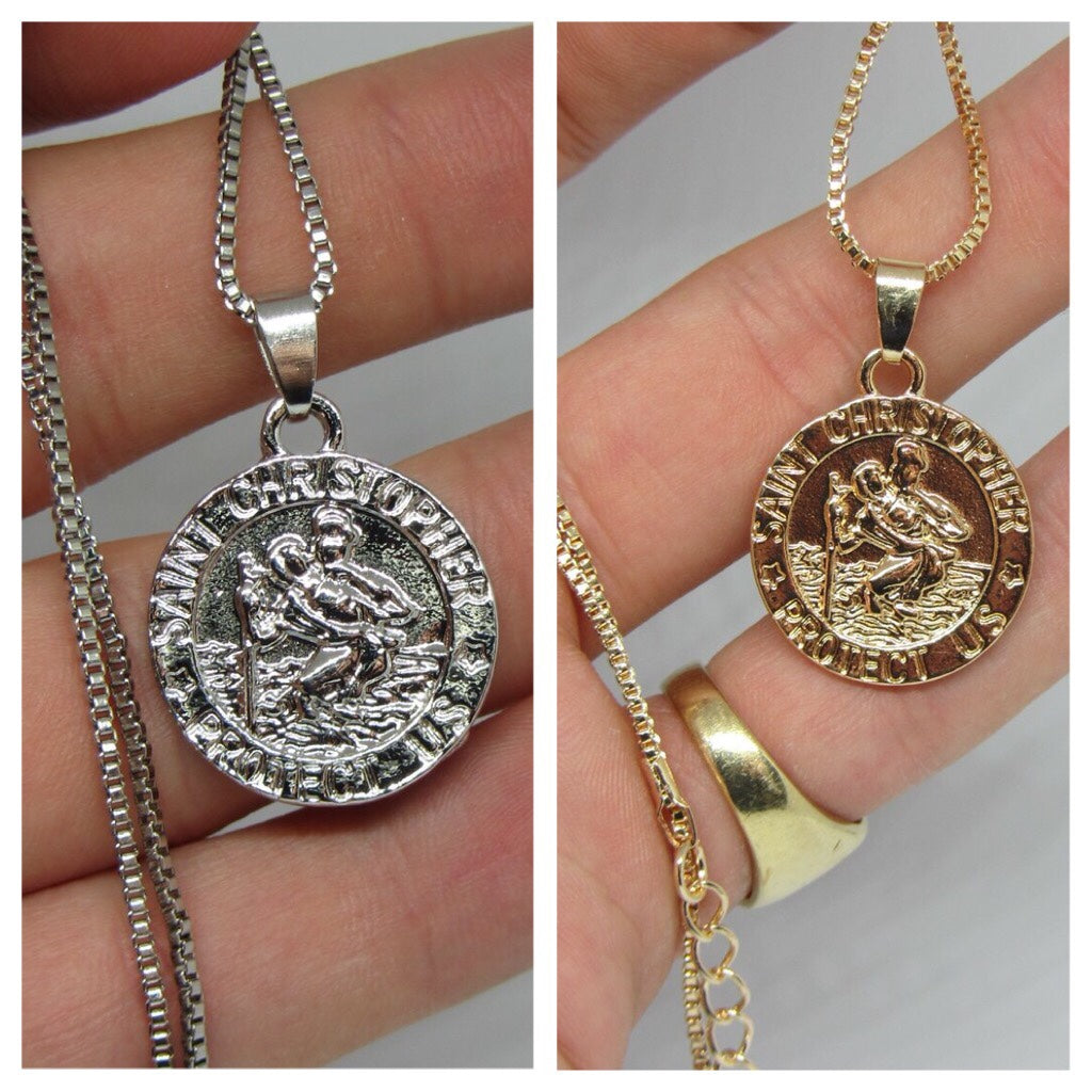 St Christopher Safe Travels Necklace featuring a gold and silver plated pendant with a 50cm chain, symbolizing protection for travelers.