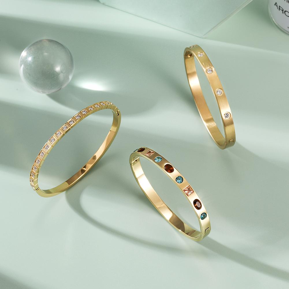 A stylish Stacked CZ Bangle Set featuring multiple bangles adorned with sparkling cubic zirconia stones, elegantly displayed in a gift box.