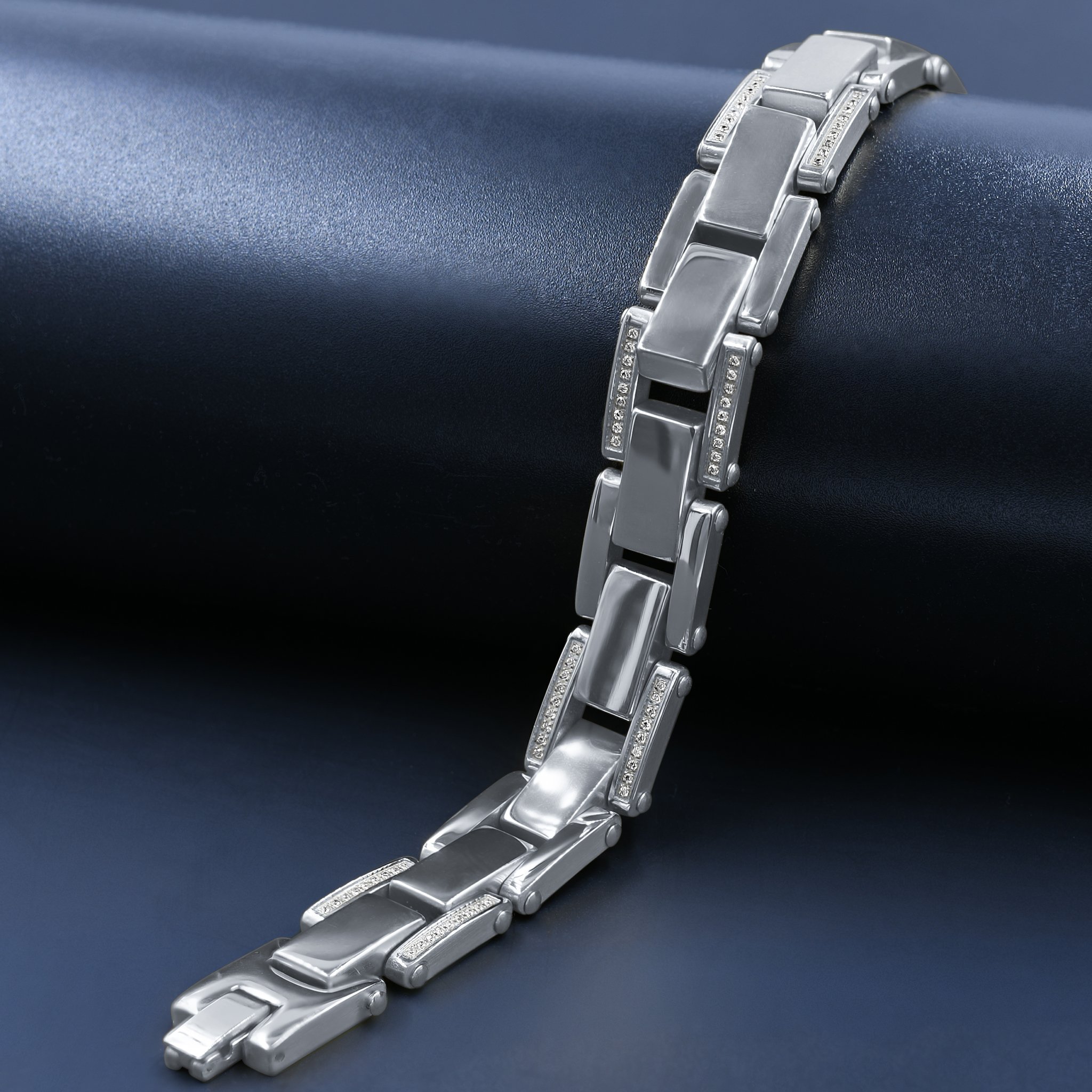 A stylish stainless steel bracelet featuring sparkling cubic zirconia stones, showcasing a modern design.