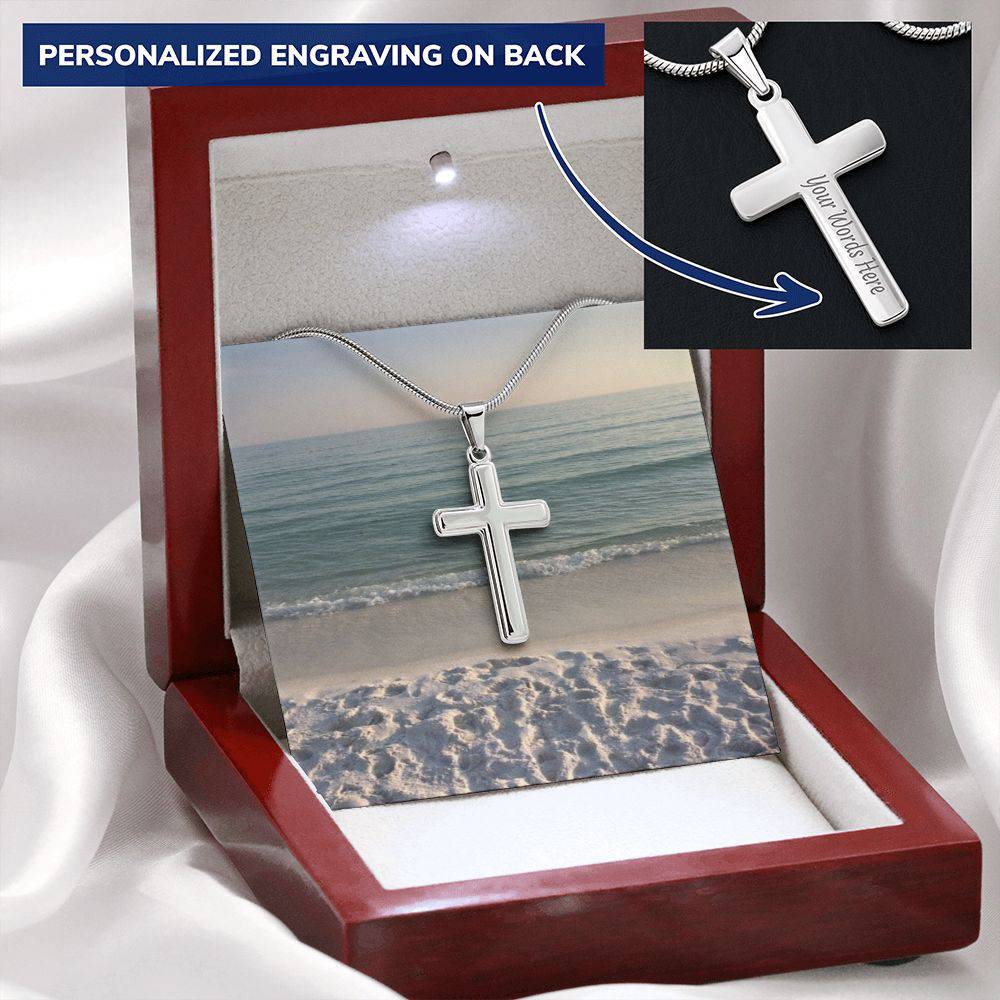 A polished stainless steel cross necklace featuring a personalized pendant, adjustable snake chain, and lobster clasp.