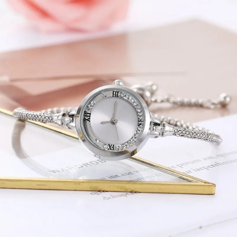 Stainless Steel Gold and Silver Bangle Adjustable Bracelet Wrist Watch with white Roman dial, showcasing elegance and versatility.