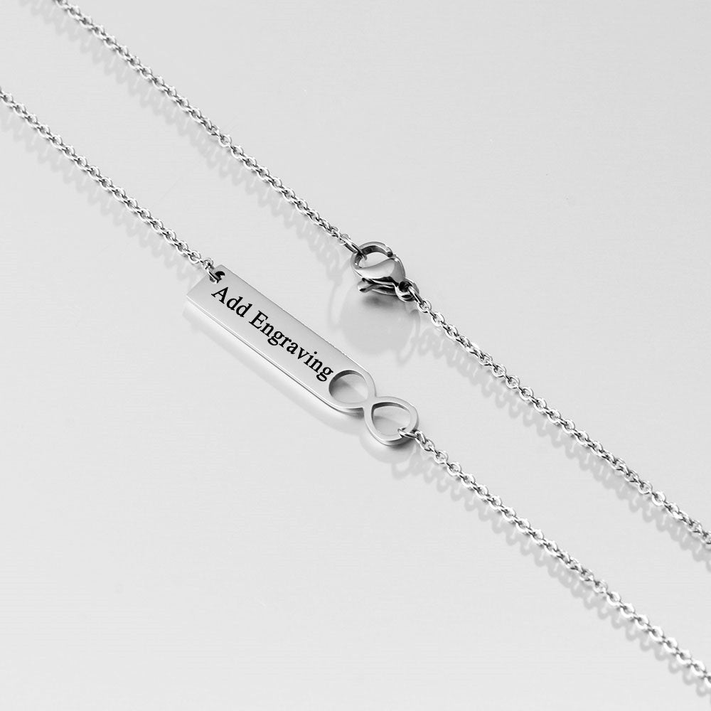 A stylish stainless steel nameplate bar necklace with a personalized pendant, showcasing its sleek design and adjustable chain.