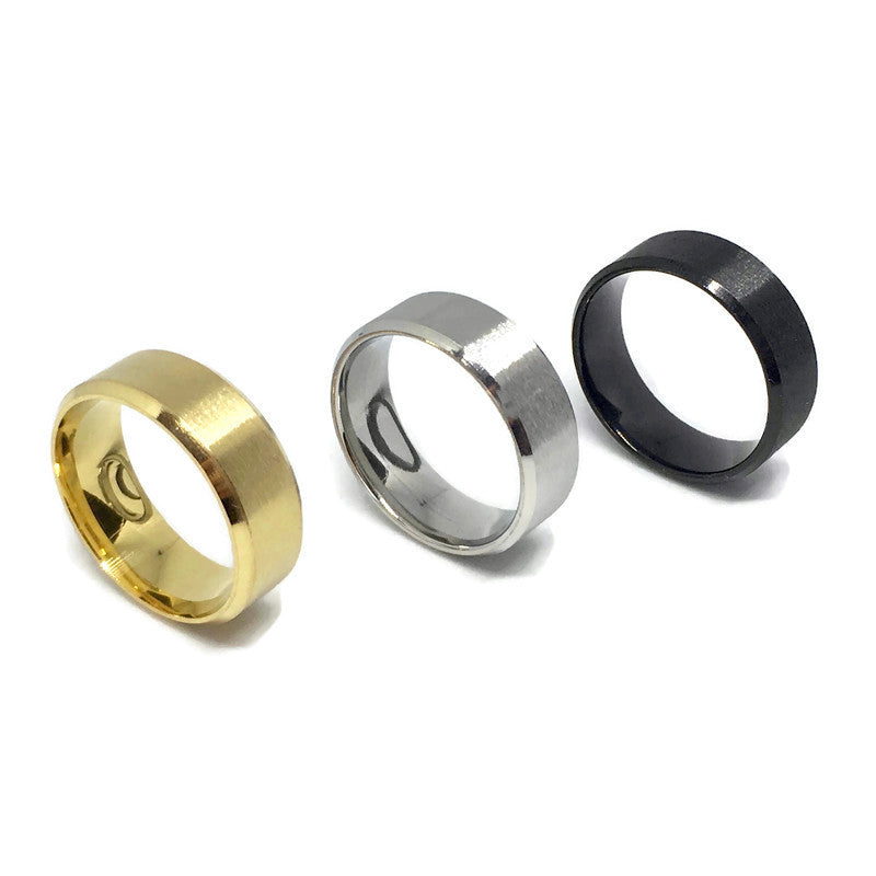 A sleek stainless steel plain band ring, showcasing its shiny surface and simple design, suitable for both men and women.