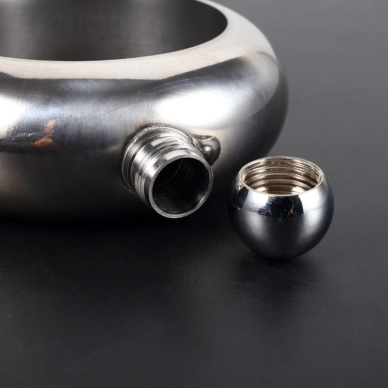 A stylish stainless steel unisex bangle featuring a hidden flask design, perfect for discreetly carrying beverages.