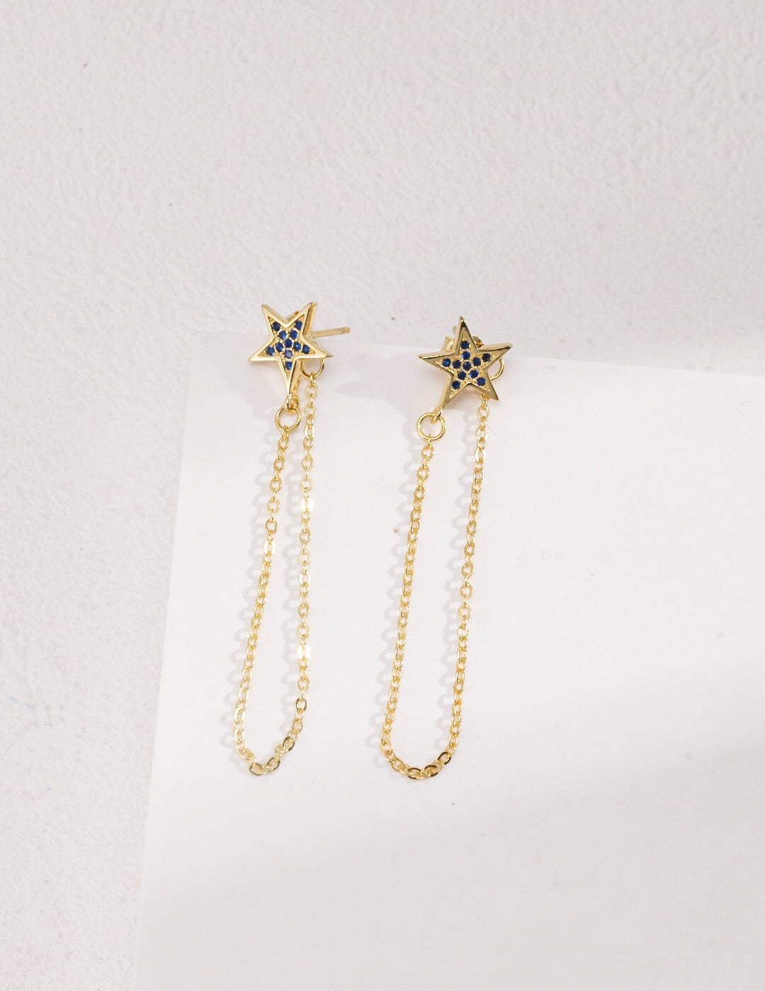 Elegant Star Dangle Threader Earrings made of gold vermeil, showcasing a unique design with a shimmering finish.