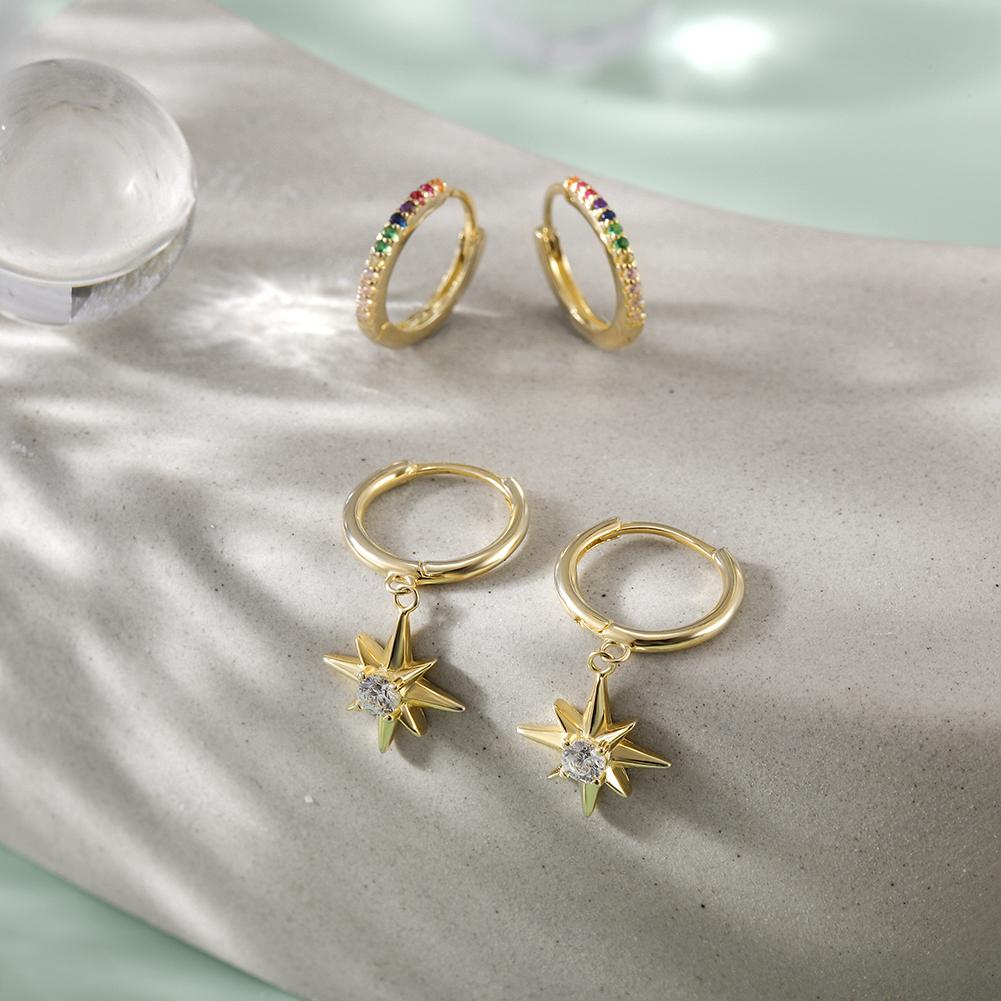 Starburst Rainbow Hoop Sets featuring vibrant cubic zirconia stones in a gold-plated sterling silver design, elegantly displayed in a gift box.