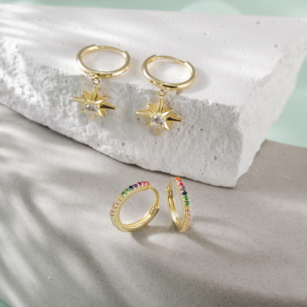 Starburst Rainbow Hoop Sets featuring vibrant cubic zirconia stones in a gold-plated sterling silver design, elegantly displayed in a gift box.