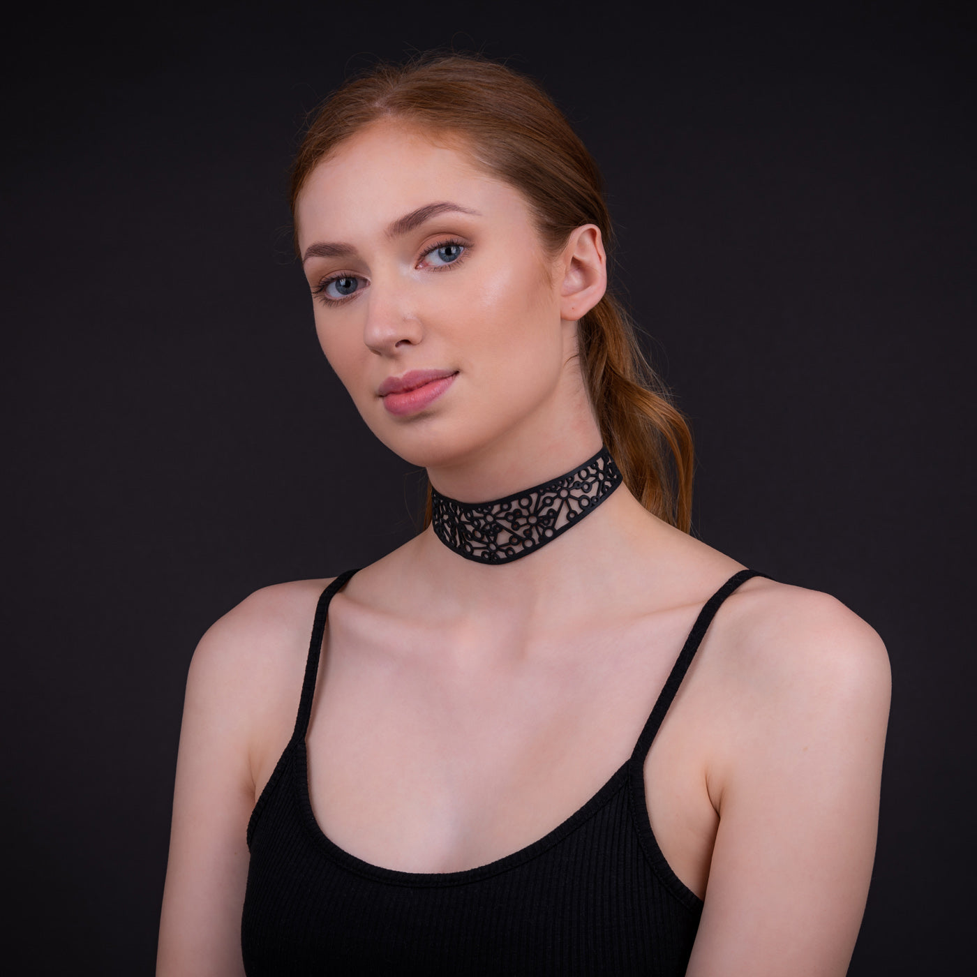 Stargate Statement Vegan Choker made from recycled rubber, featuring a bold retro design and adjustable length with two buttons.