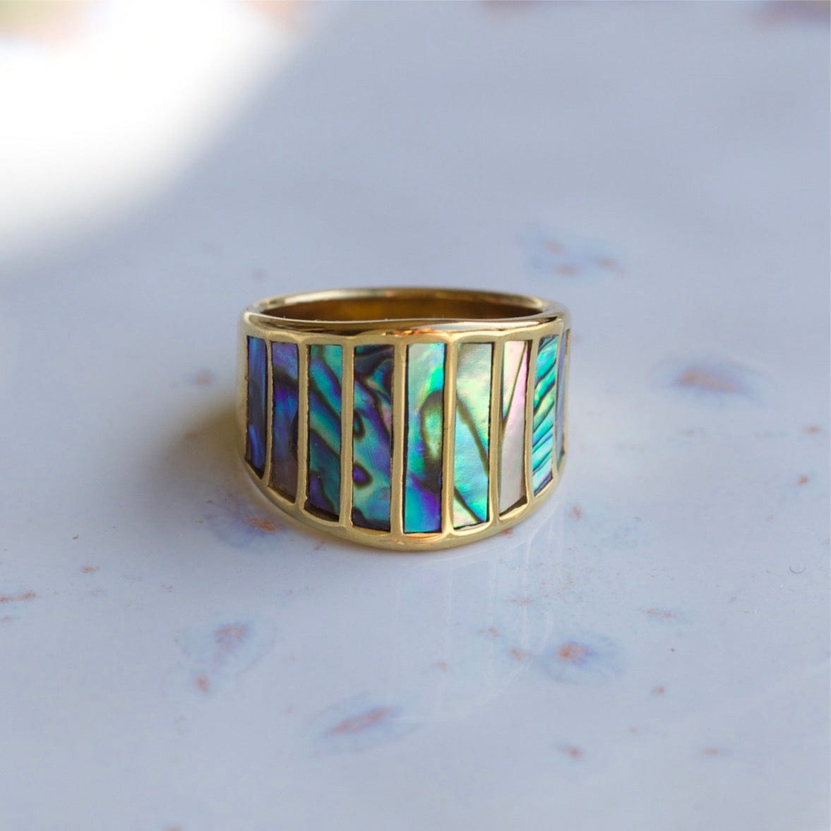 Stella Abalone Shell Statement Ring featuring geometric design and natural abalone shell stones, set in 18K gold plated stainless steel.